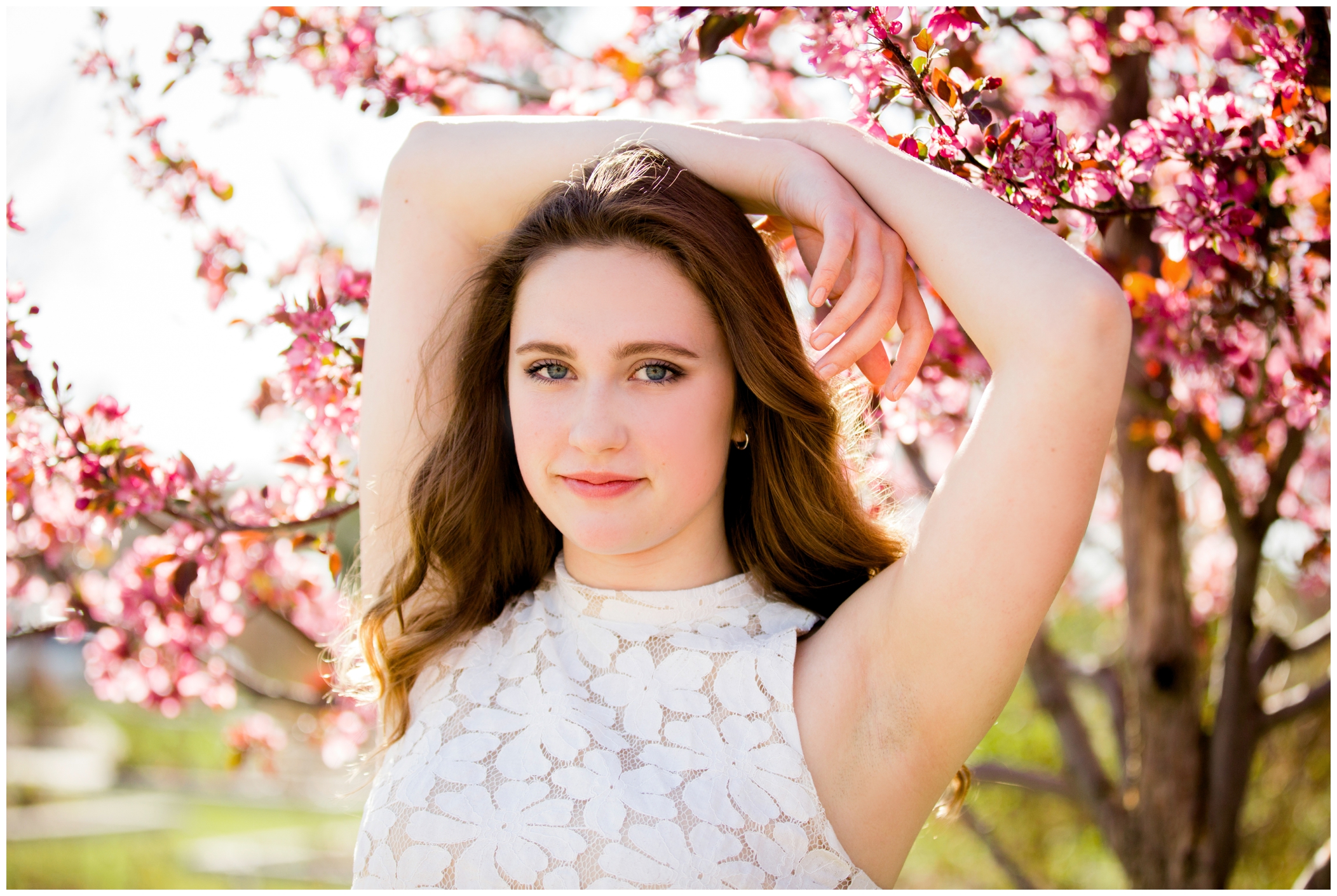 Longmont senior portraits with cherry blossom trees 