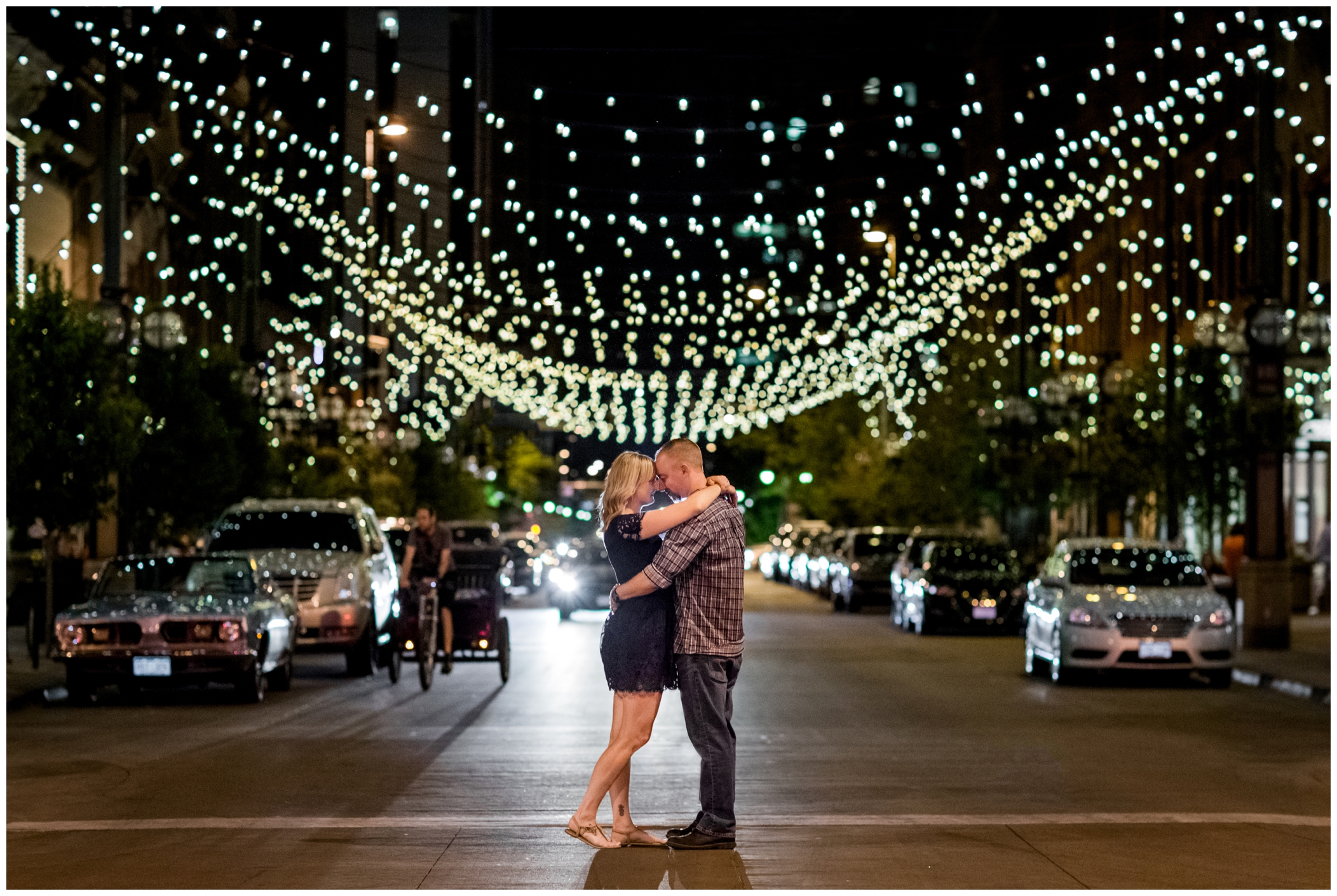 couple posing in the street at night engagement photos at Larimer Square in Denver Colorado 