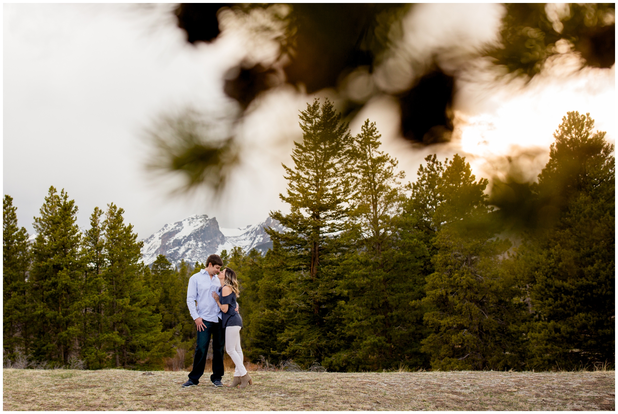 Estes Park engagement portraits in Rocky Mountain National Park at Sprague Lake and Moraine Park. Spring mountain couples photos by Plum Pretty Photography.