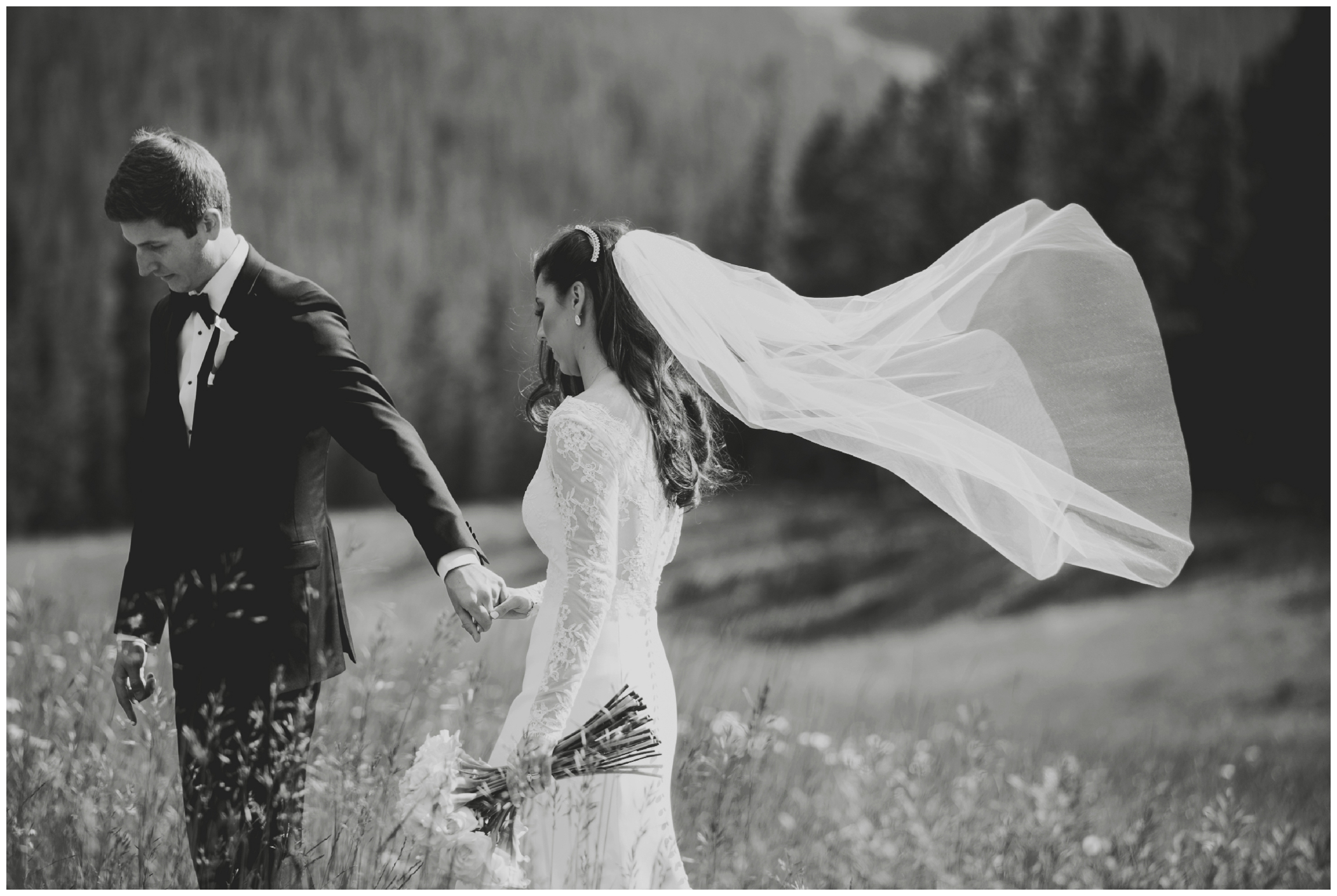 bride's veil flying in the wind during keystone colorado wedding pictures 
