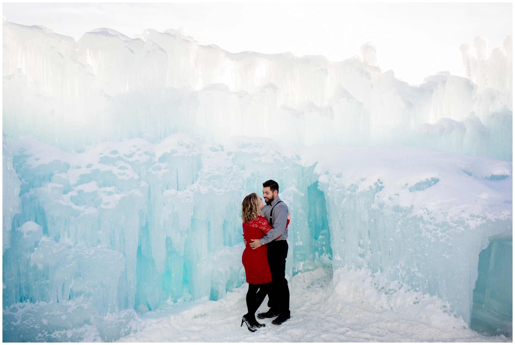 woman in red dress during ice castle engagement photos in Dillon Colorado 