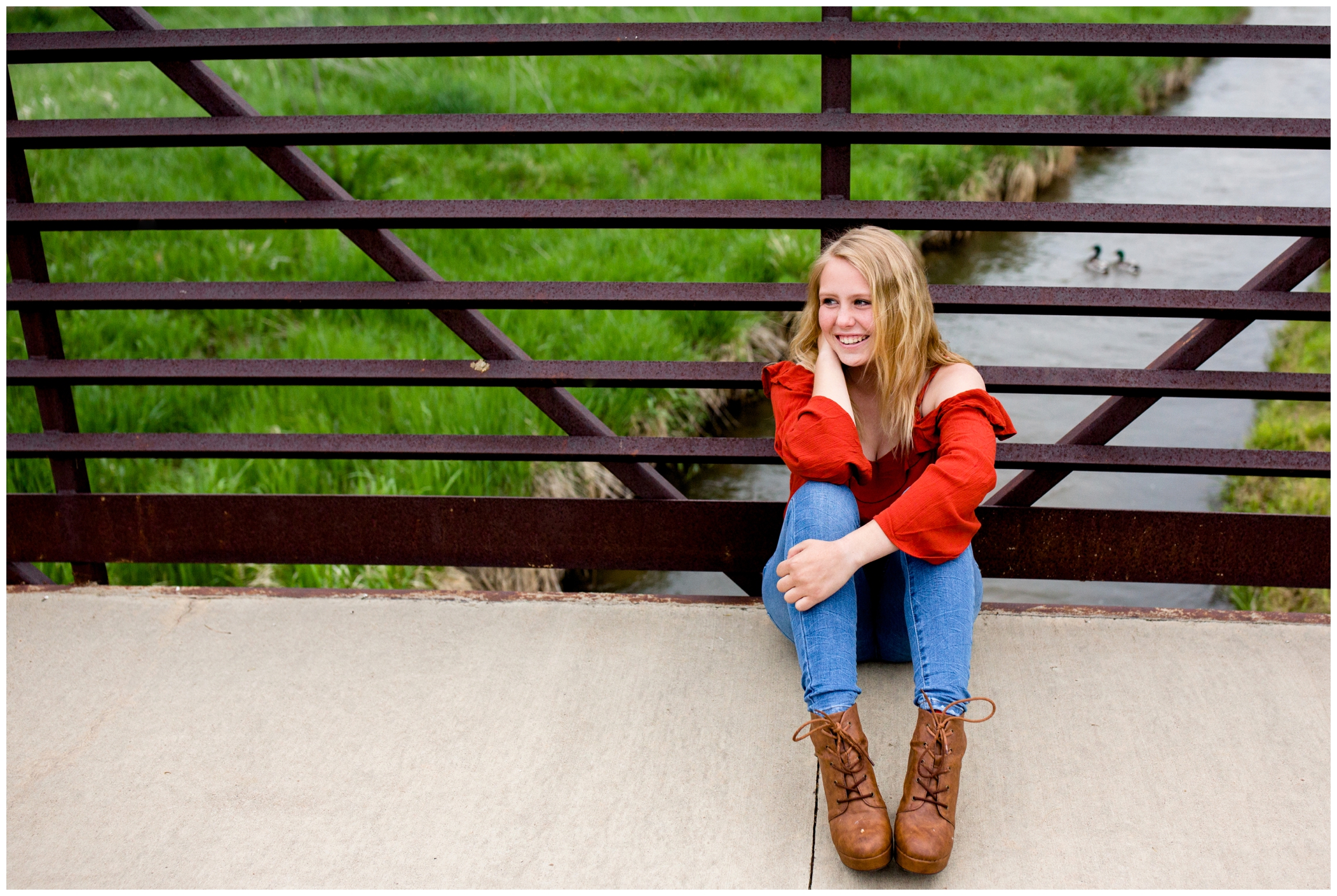 senior portraits of a girl sitting on a bridge in Longmont Colorado 