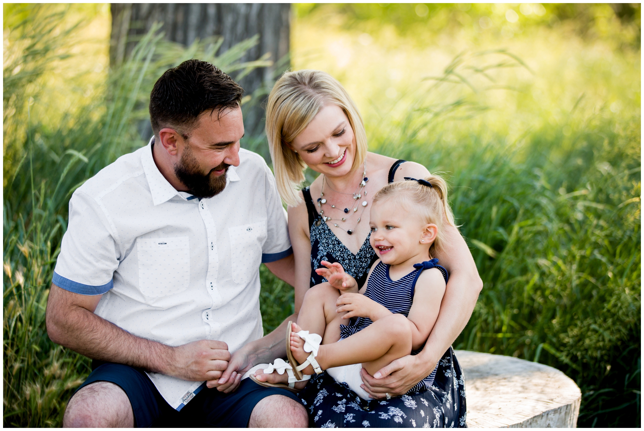 parents tickling daughter during Loveland family photos 