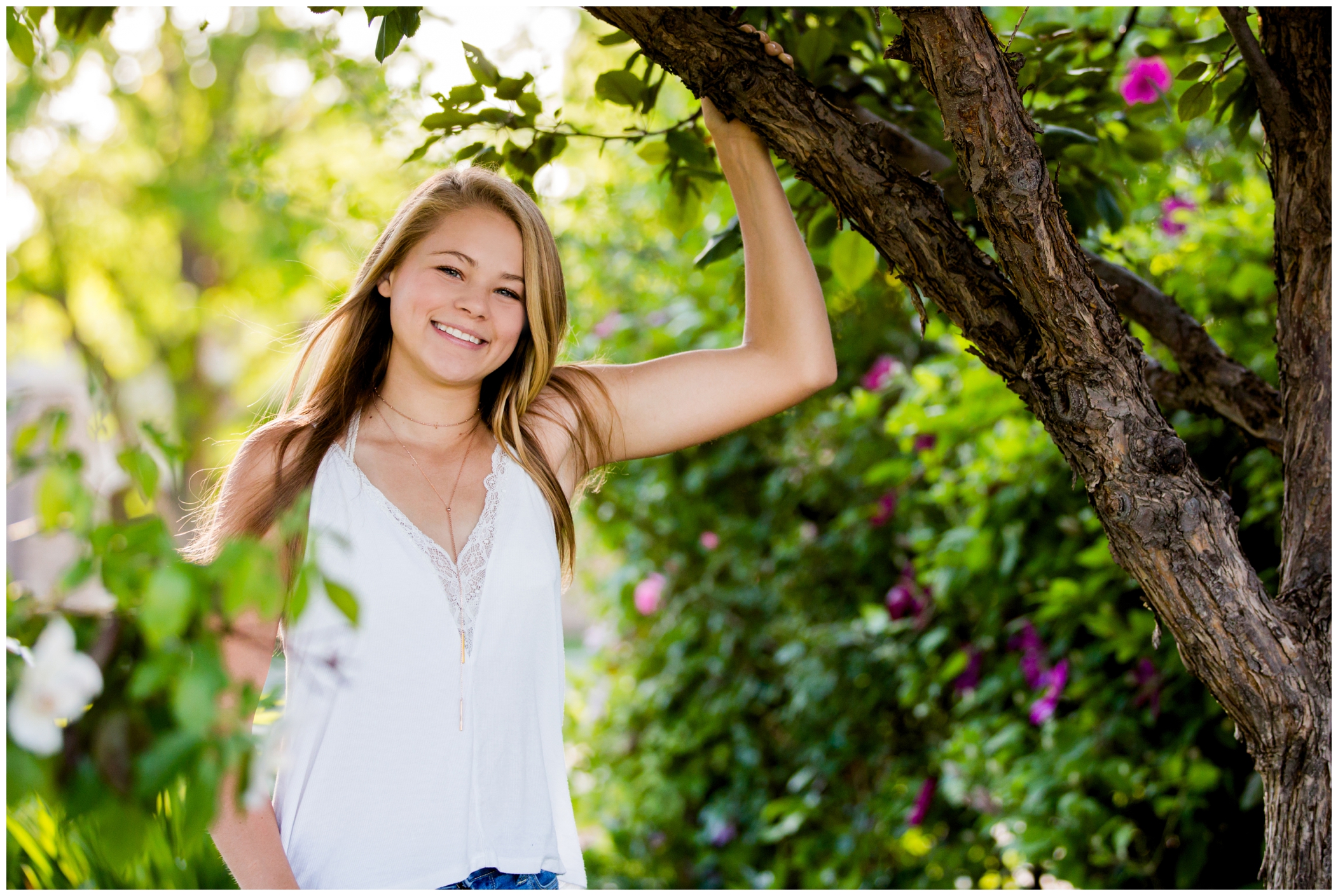 girl leaning against a tree during Niwot Colorado senior pictures 