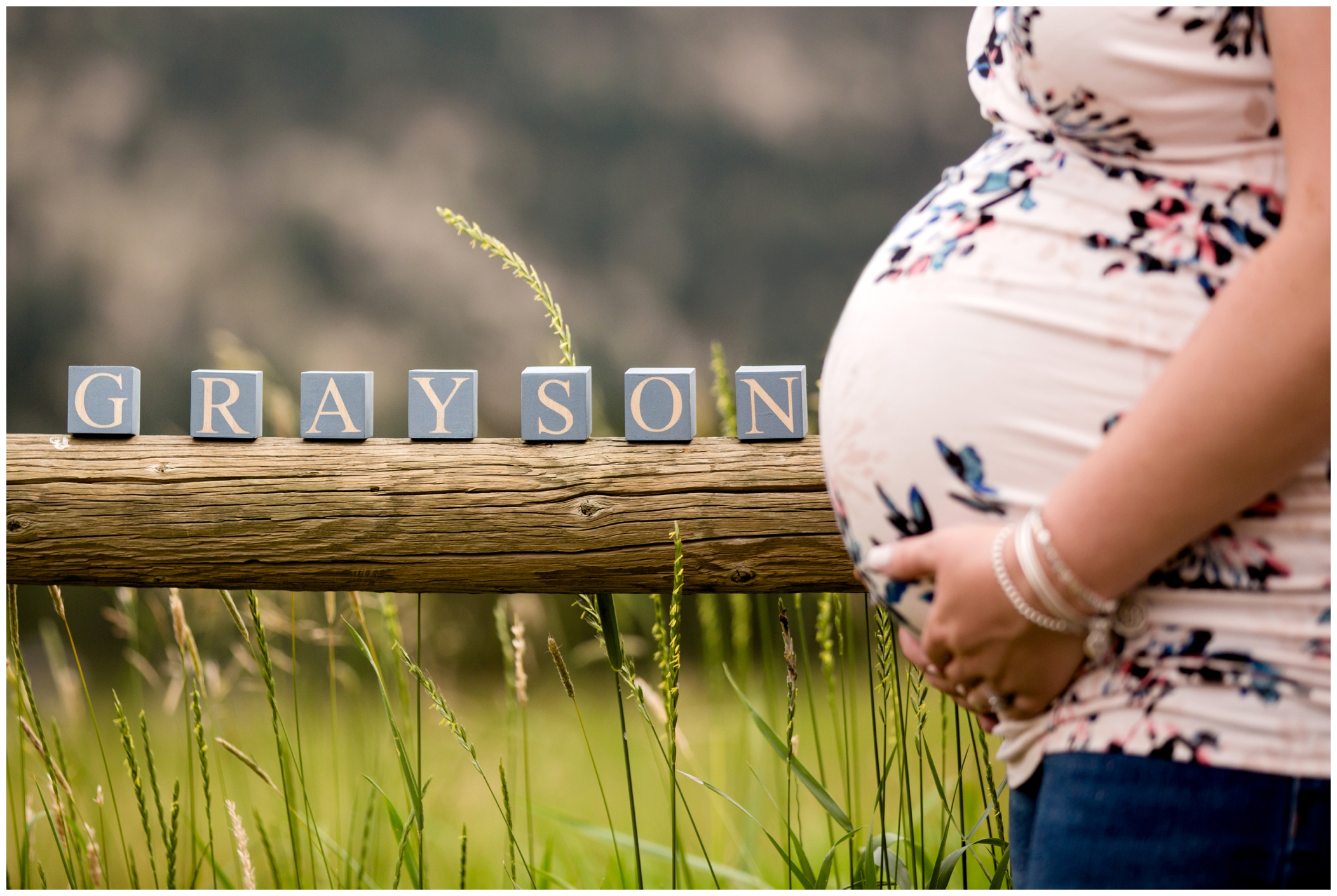 pregnant belly with name blocks at Evergreen CO maternity photography session 