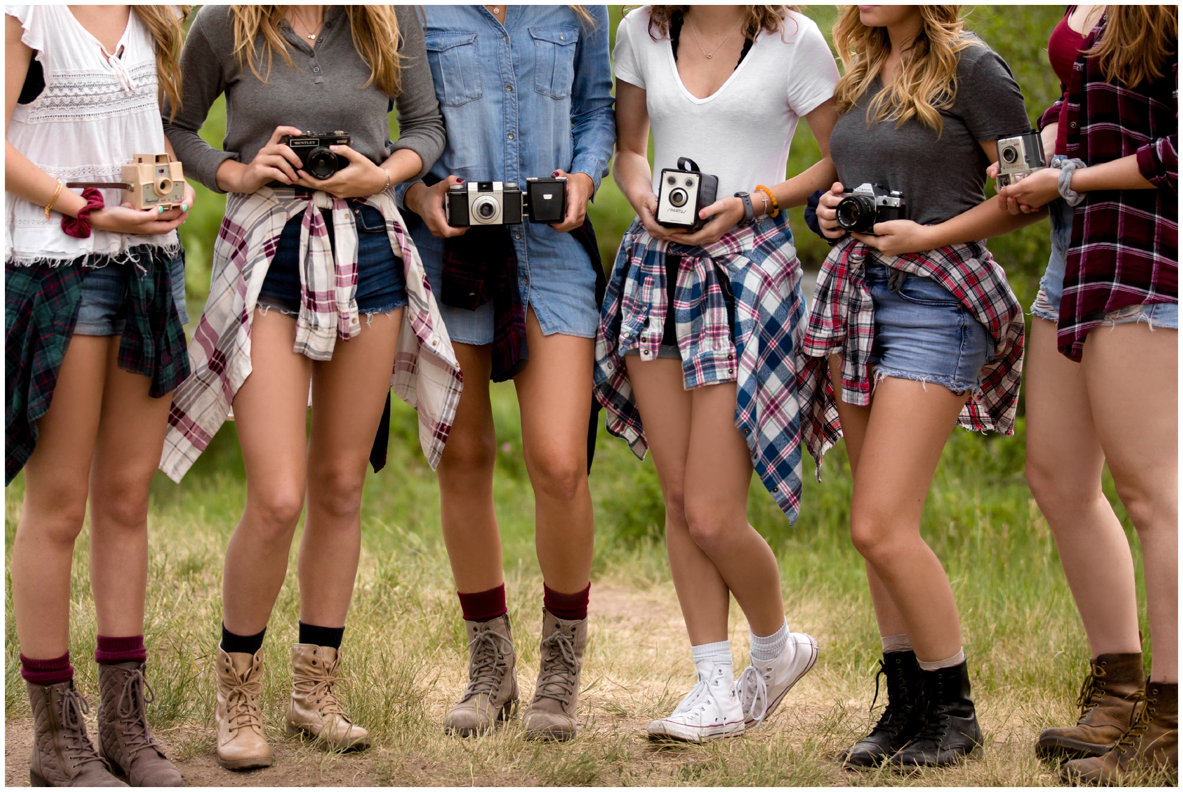 group of girls holding vintage cameras during group senior rep shoot in Estes Park Colorado 