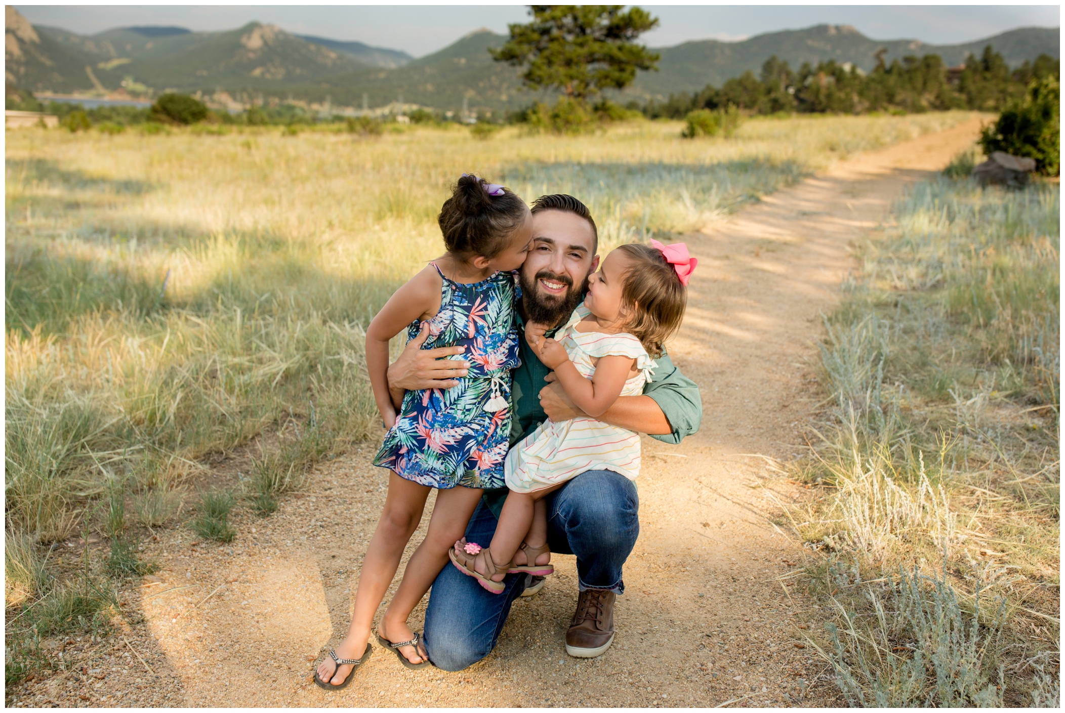 girls kissing dad during Estes Park Colorado family photos 