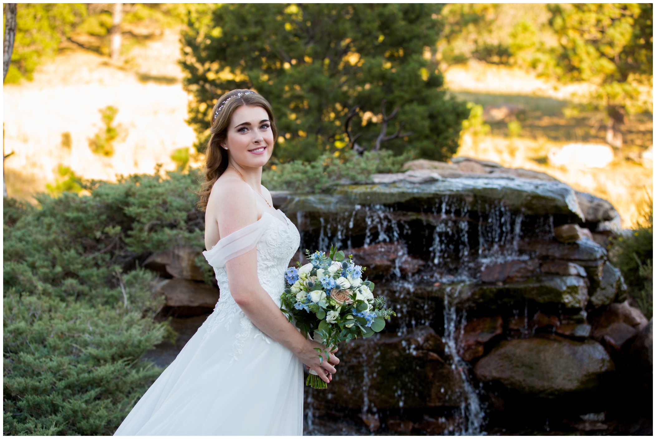 bride by water fountain at Flying Horse Ranch Colorado 