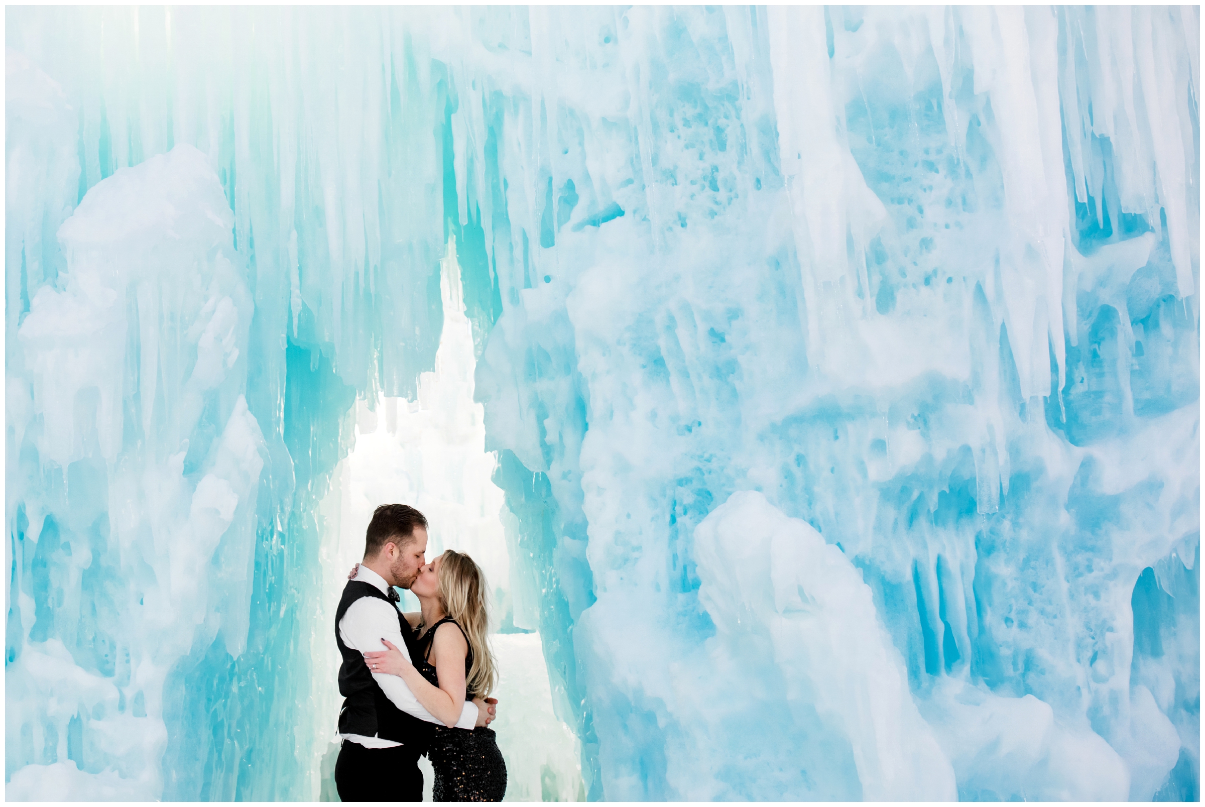 couple kissing during Breckenridge engagement photographs at the Dillon Colorado ice castles