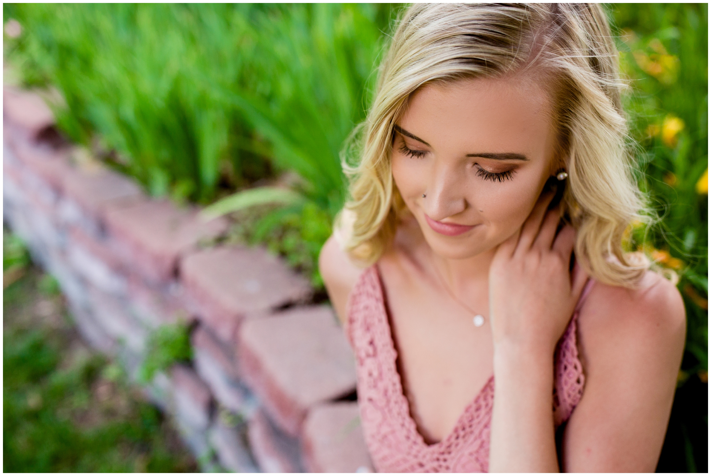 girl sitting in a garden for her Longmont Colorado senior pictures 