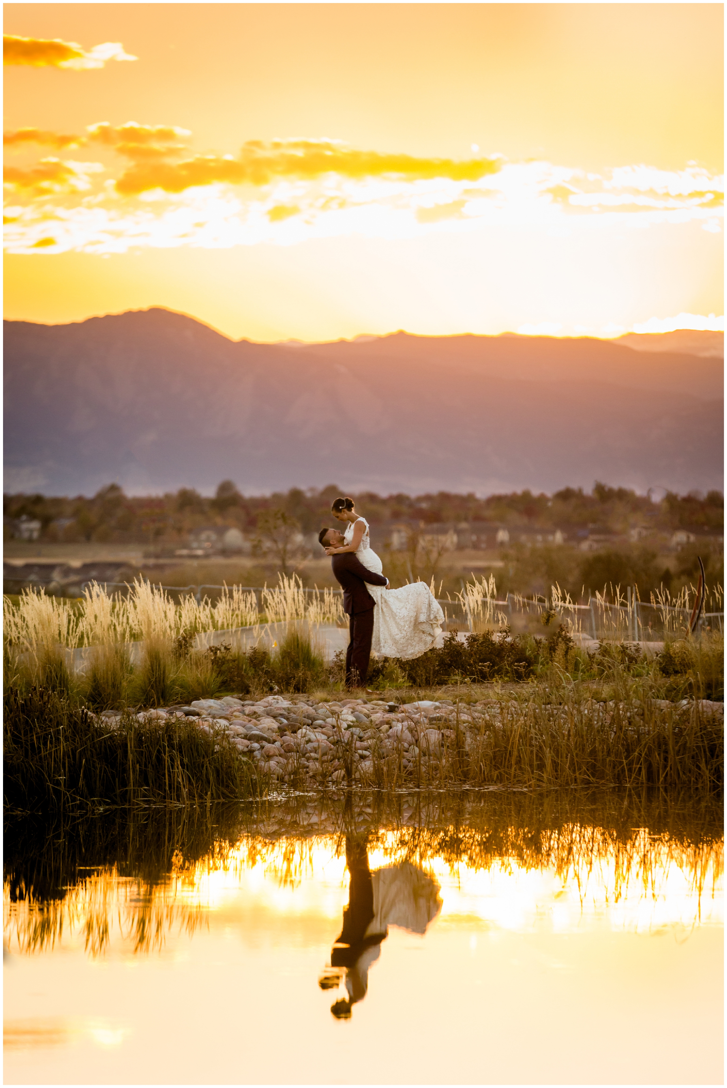 colorful sunset wedding photos with mountains in background at The Overlook at Colliers Hill in Erie Colorado 