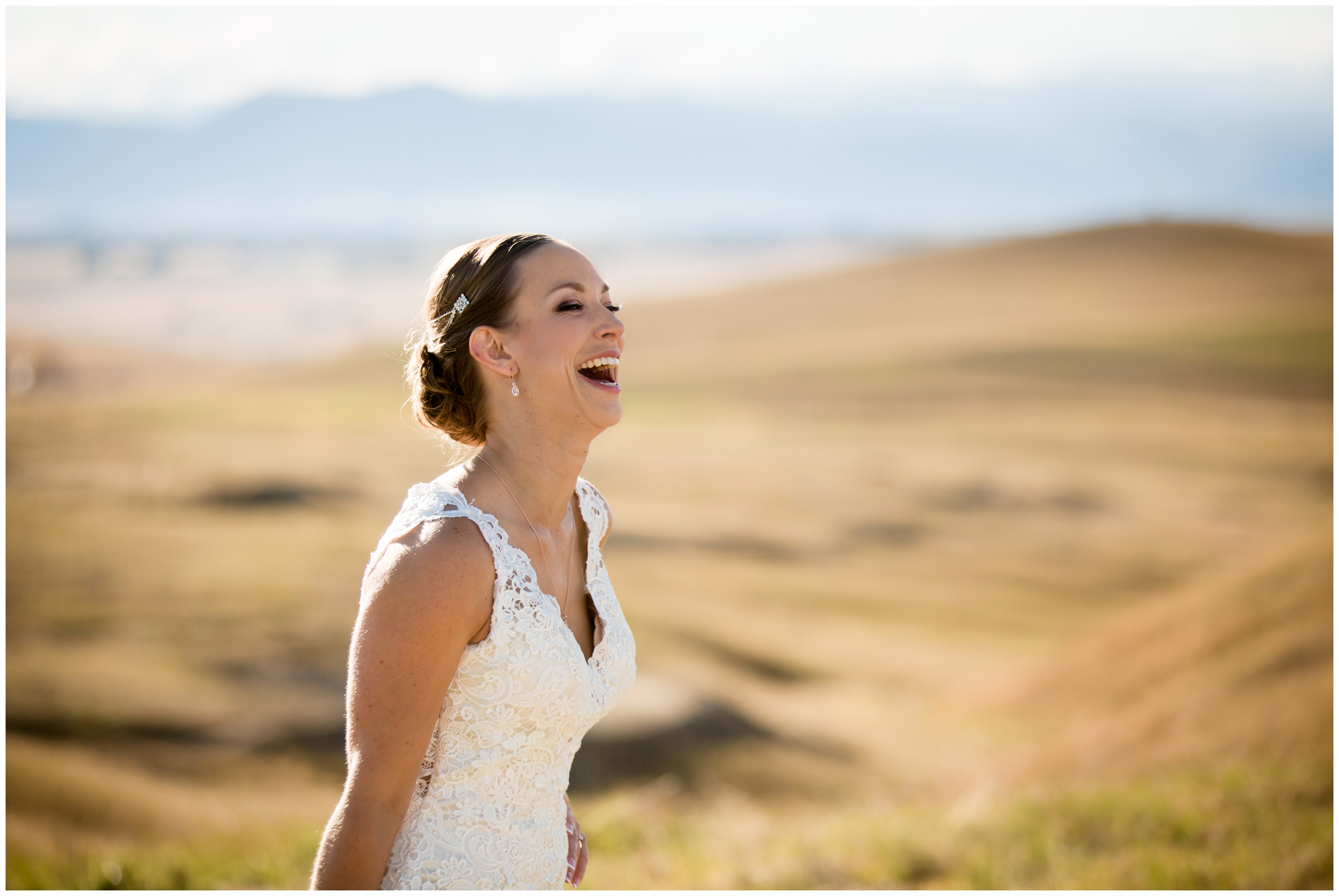 bride laughing with mountains in background at Erie Colorado wedding 