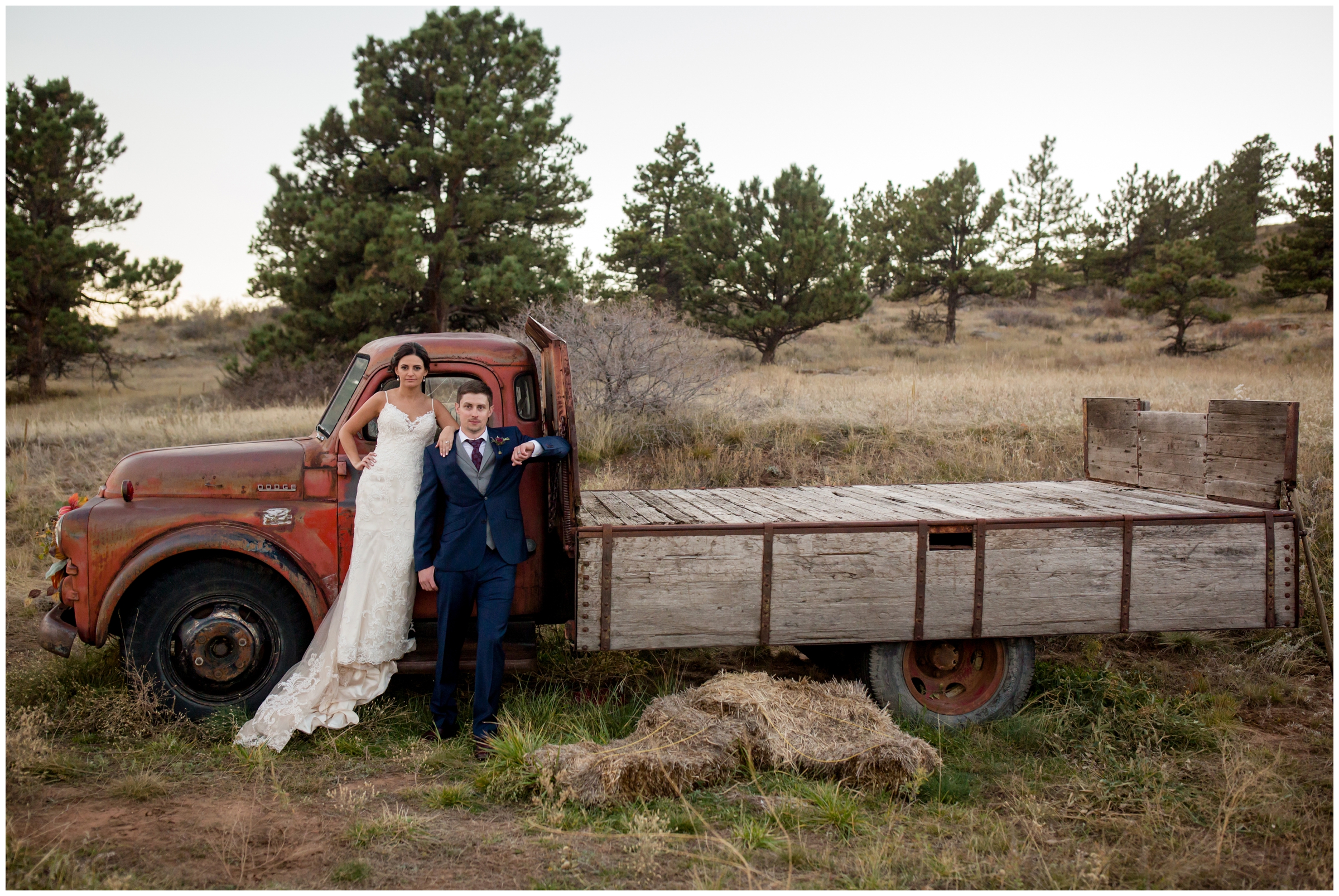 couple standing on old truck during Lionscrest manor wedding pictures by Colorado photographer Plum Pretty Photography