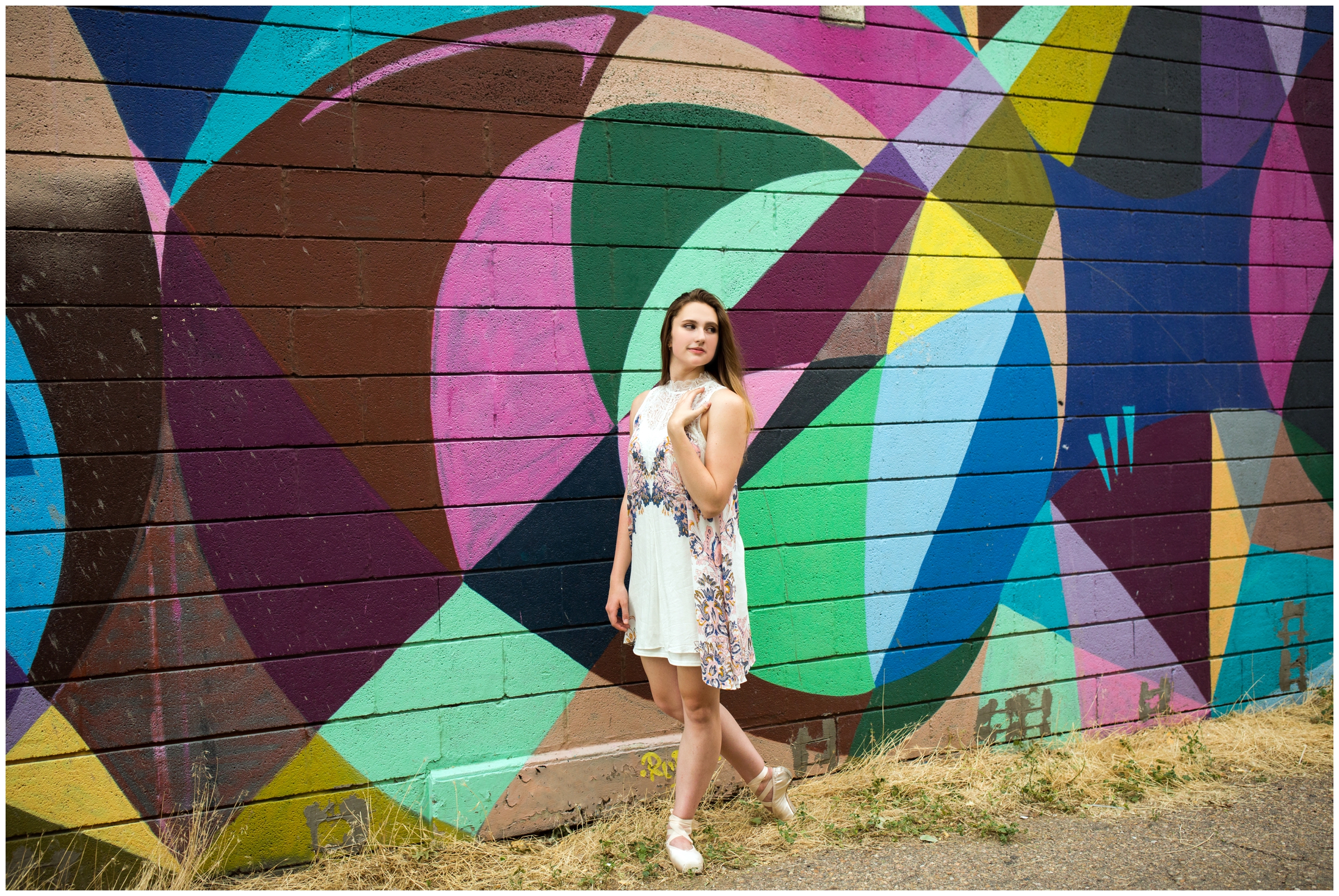 ballet dancer senior portraits with a colorful mural backdrop in Boulder Colorado 
