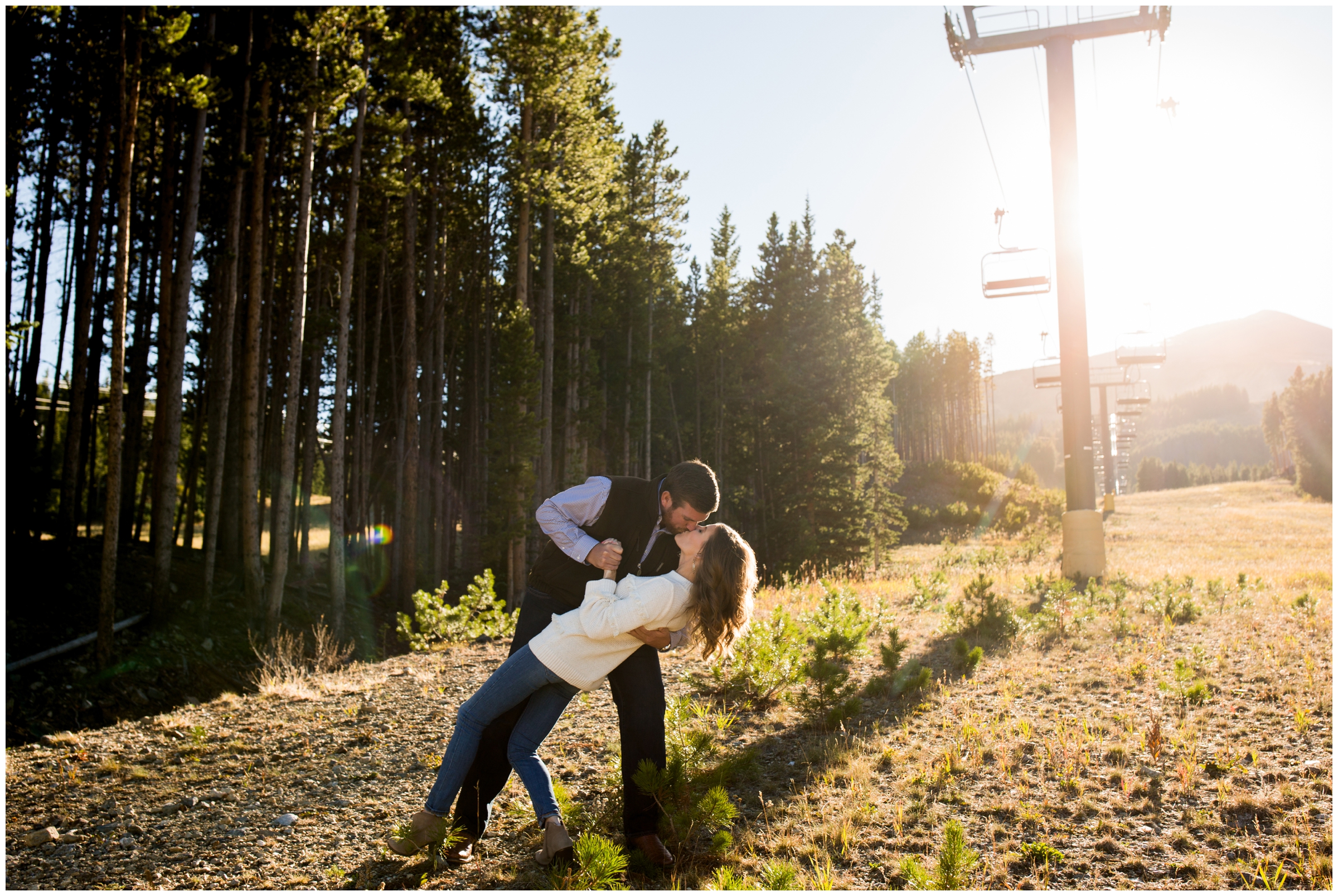 guy dipping girl during Breckenridge Colorado ski resort engagement photography session