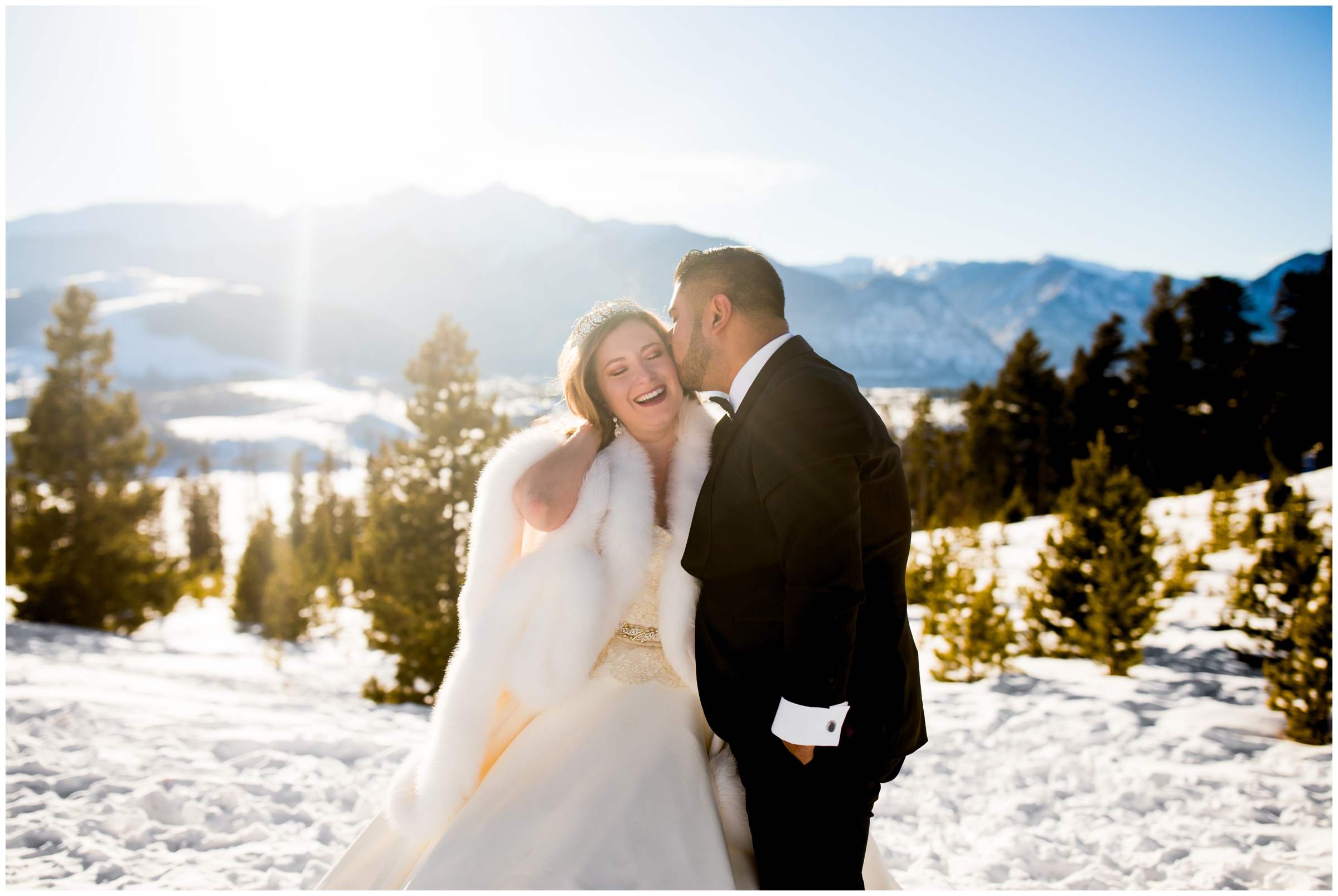 couple kissing in the snow at Sapphire Point Breckenridge Colorado winter wedding photos 
