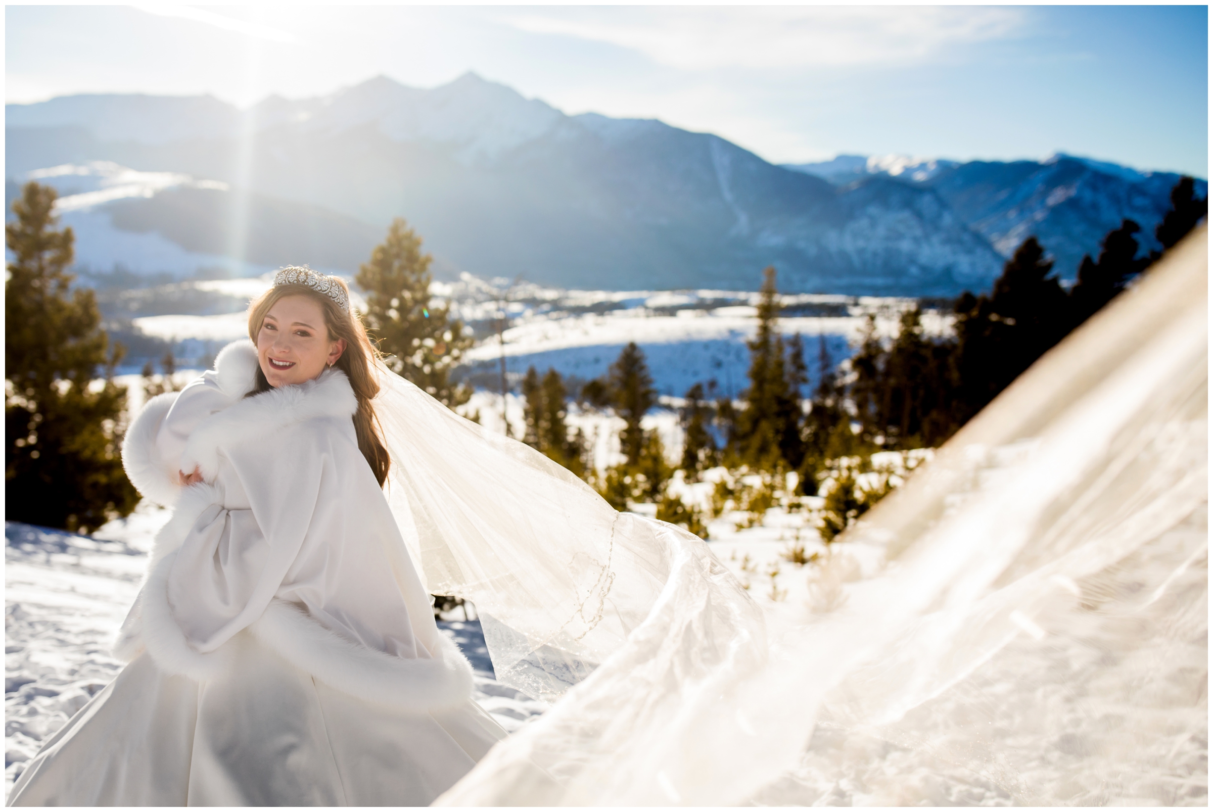 cathedral veil flying during snowy Breckenridge Colorado wedding at Sapphire Point overlook 