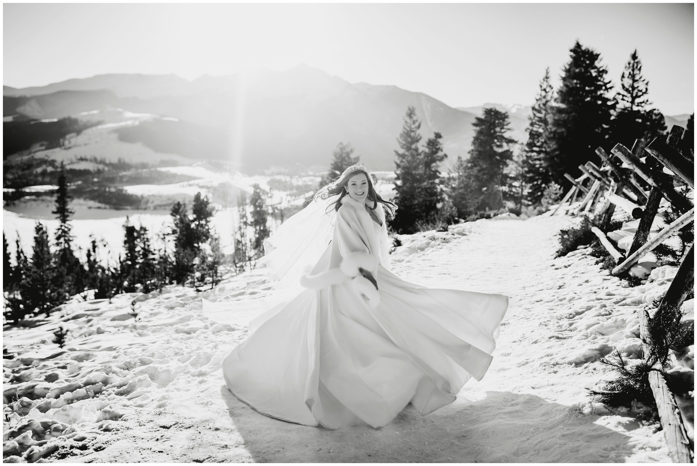 bride spinning in wedding dress at Sapphire Point Overlook Breckenridge Colorado winter elopement 