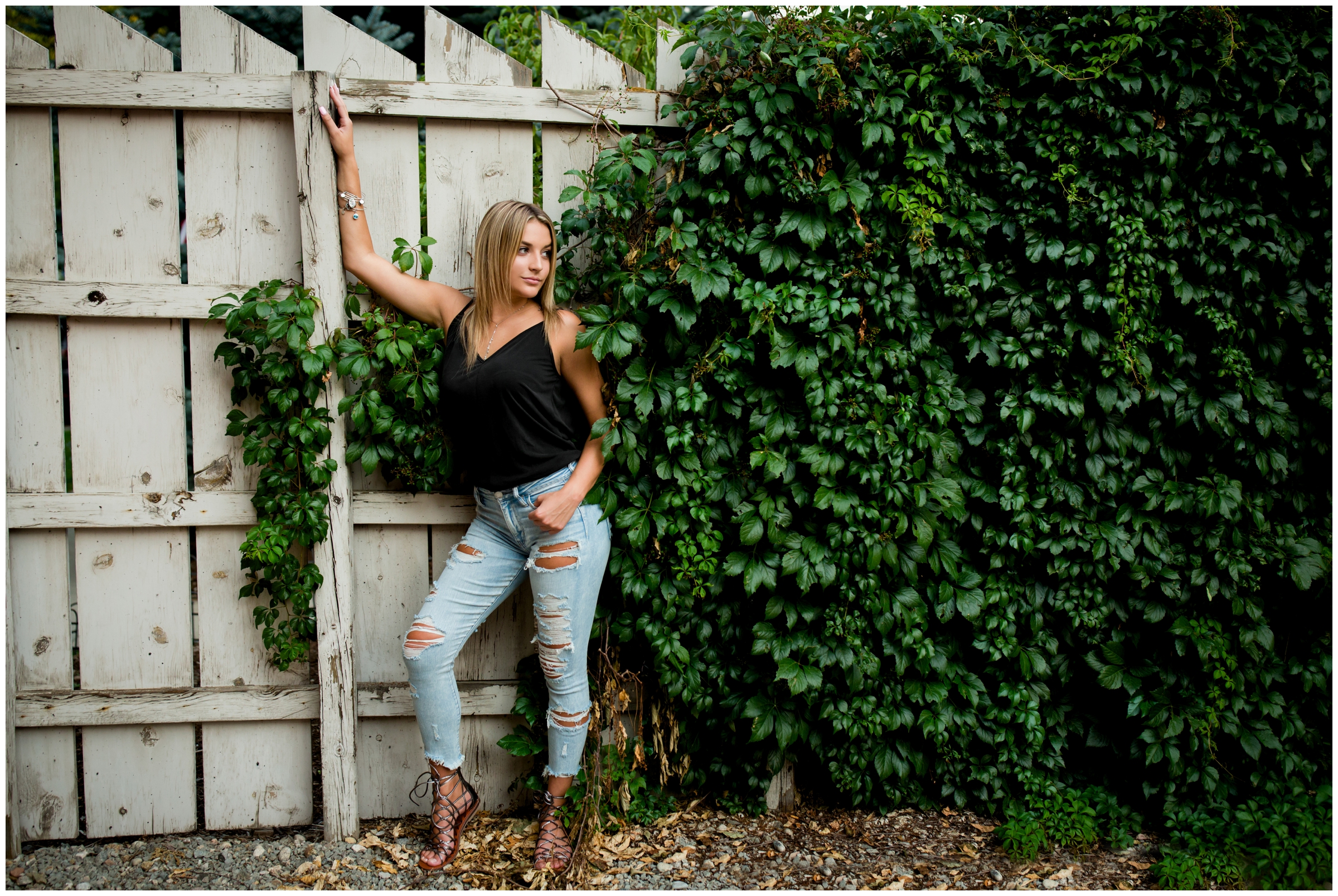 teen girl standing against ivy wall in Prospect during Longmont Colorado senior photos 