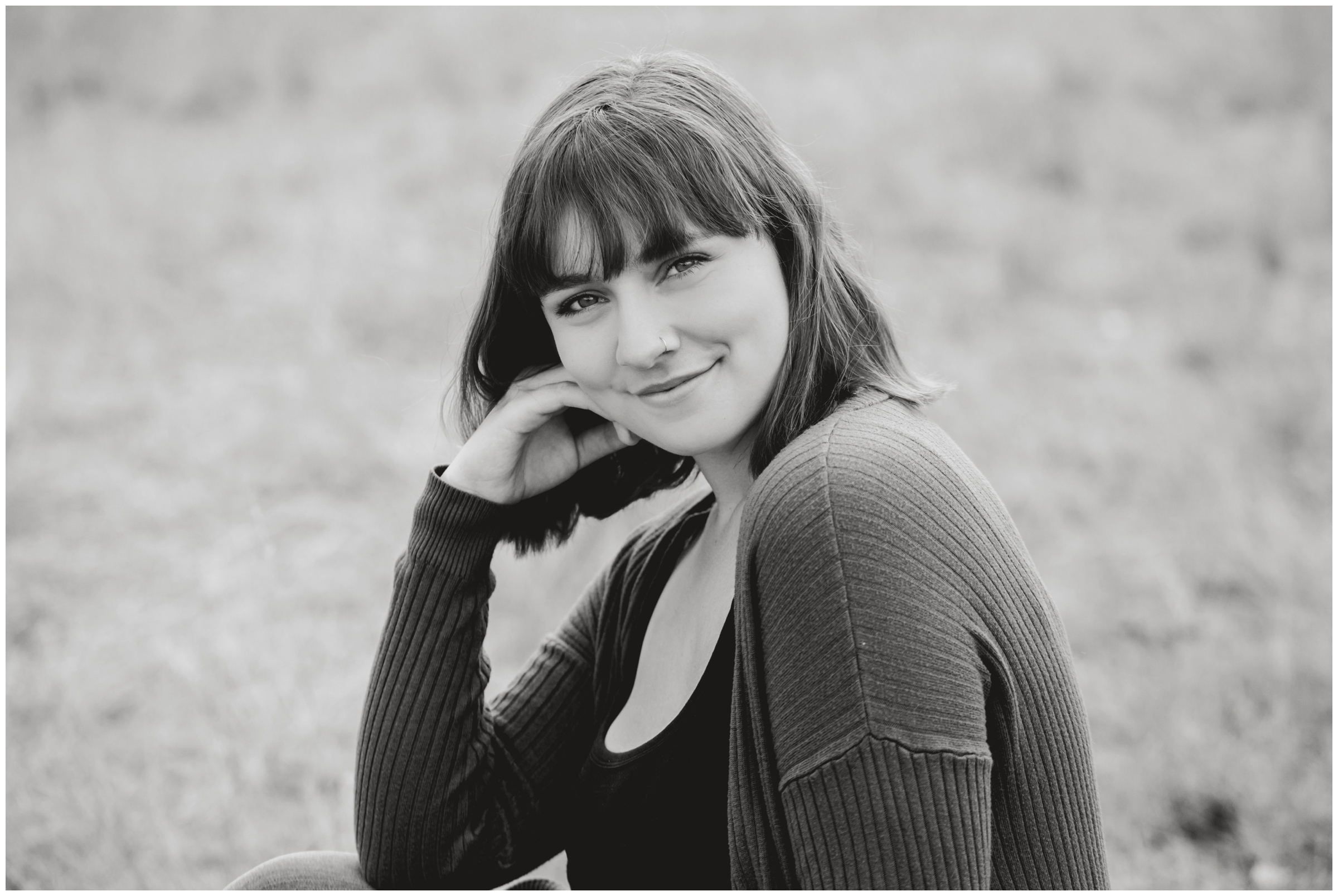 teen girl posing in field at Boulder Colorado senior photography session