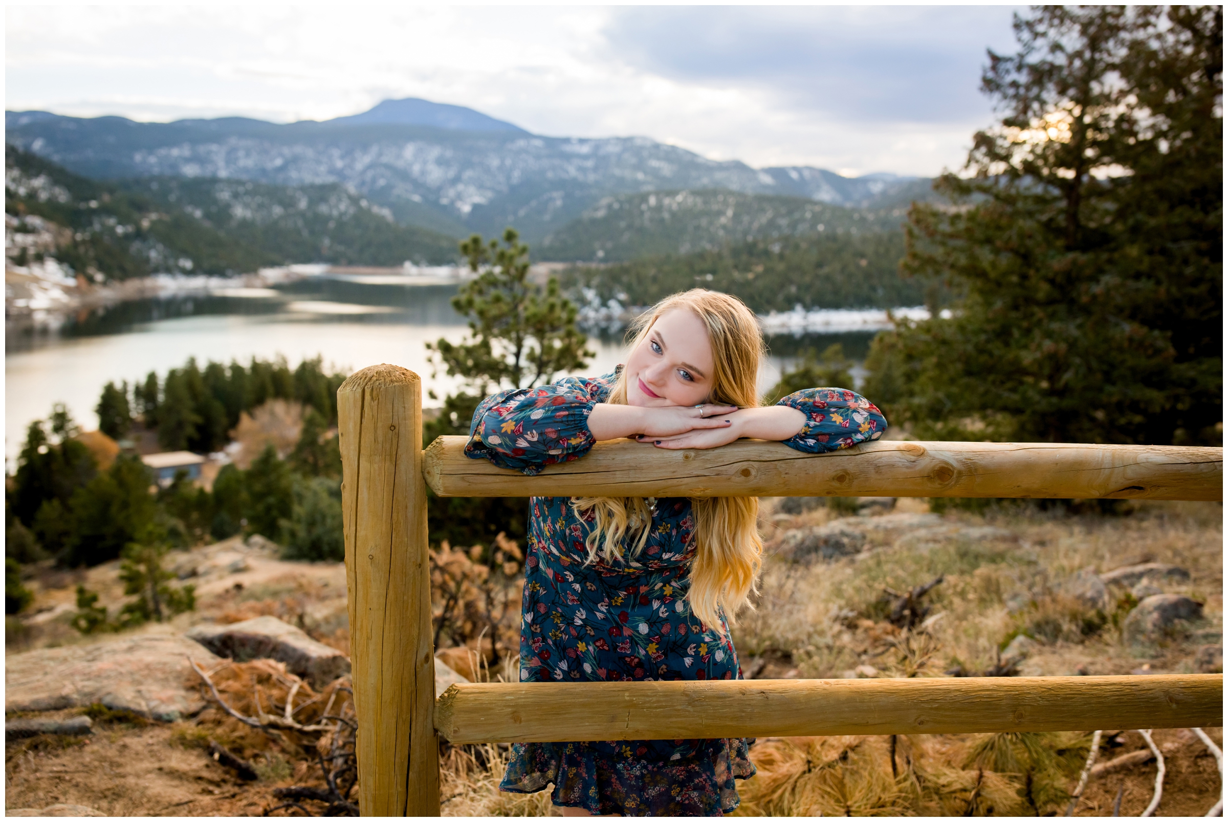 teen girl laying head on fence at Berthoud Colorado senior portraits 