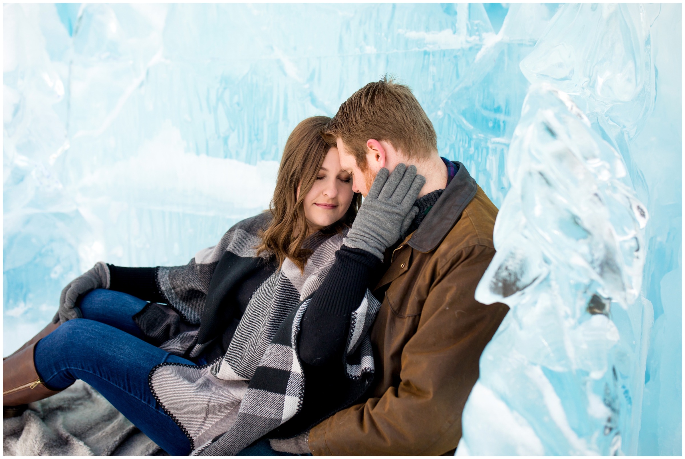 couple snuggling on bench during Breckenridge winter engagement photos at Dillon Ice Castles by Colorado wedding photographer Plum Pretty Photography