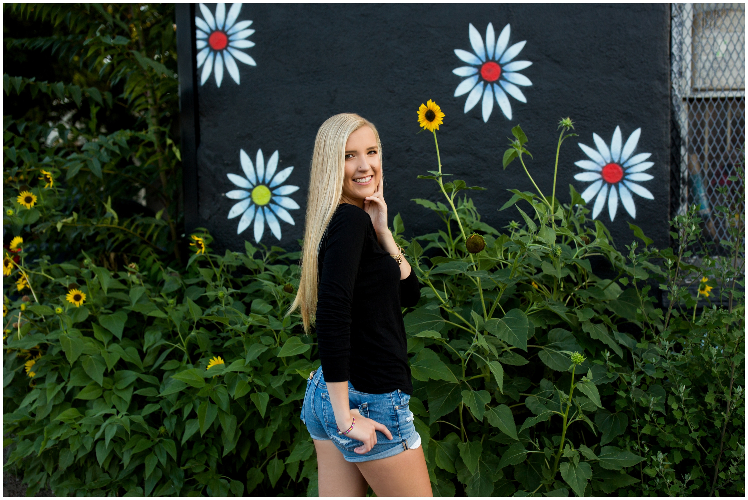 girl standing in front of sunflowers in Denver CO
