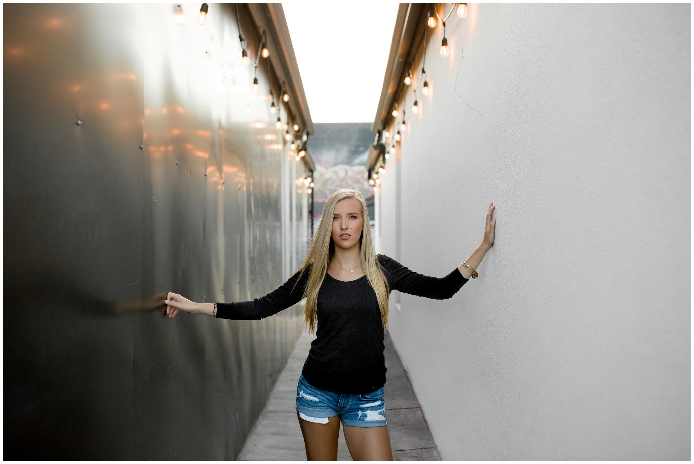 Erie High School Colorado teen girl posing in hallway at urban Denver senior photography session
