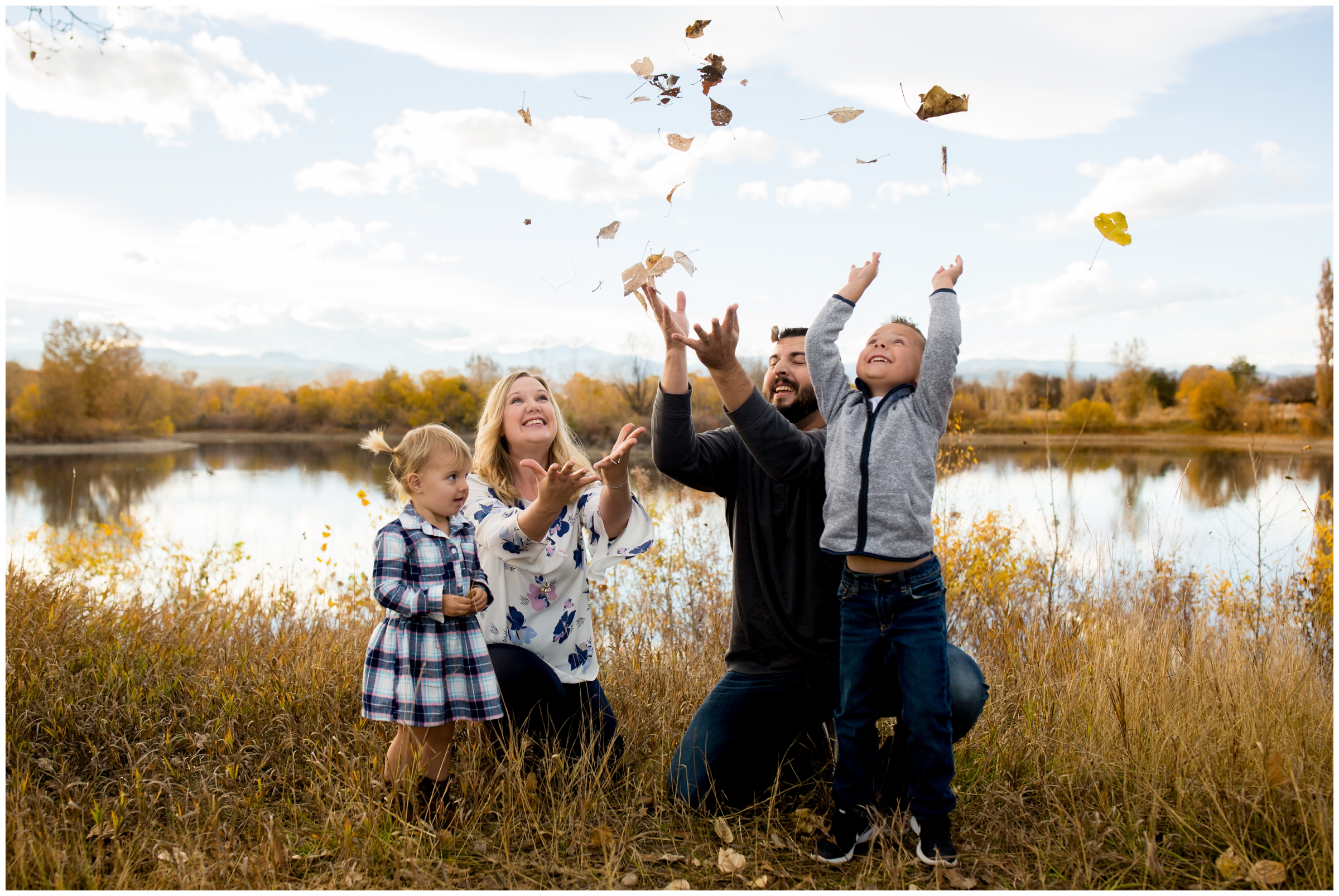 family throwing leaves during fall Colorado family photos 