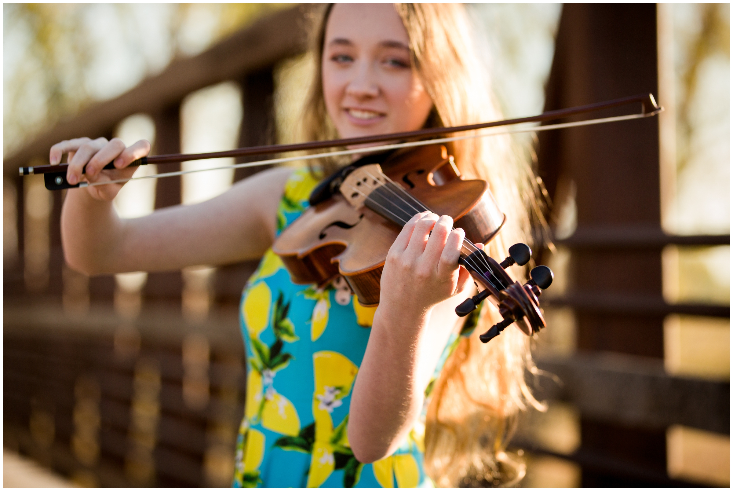 teen girl playing viola during Longmont Colorado senior pictures 