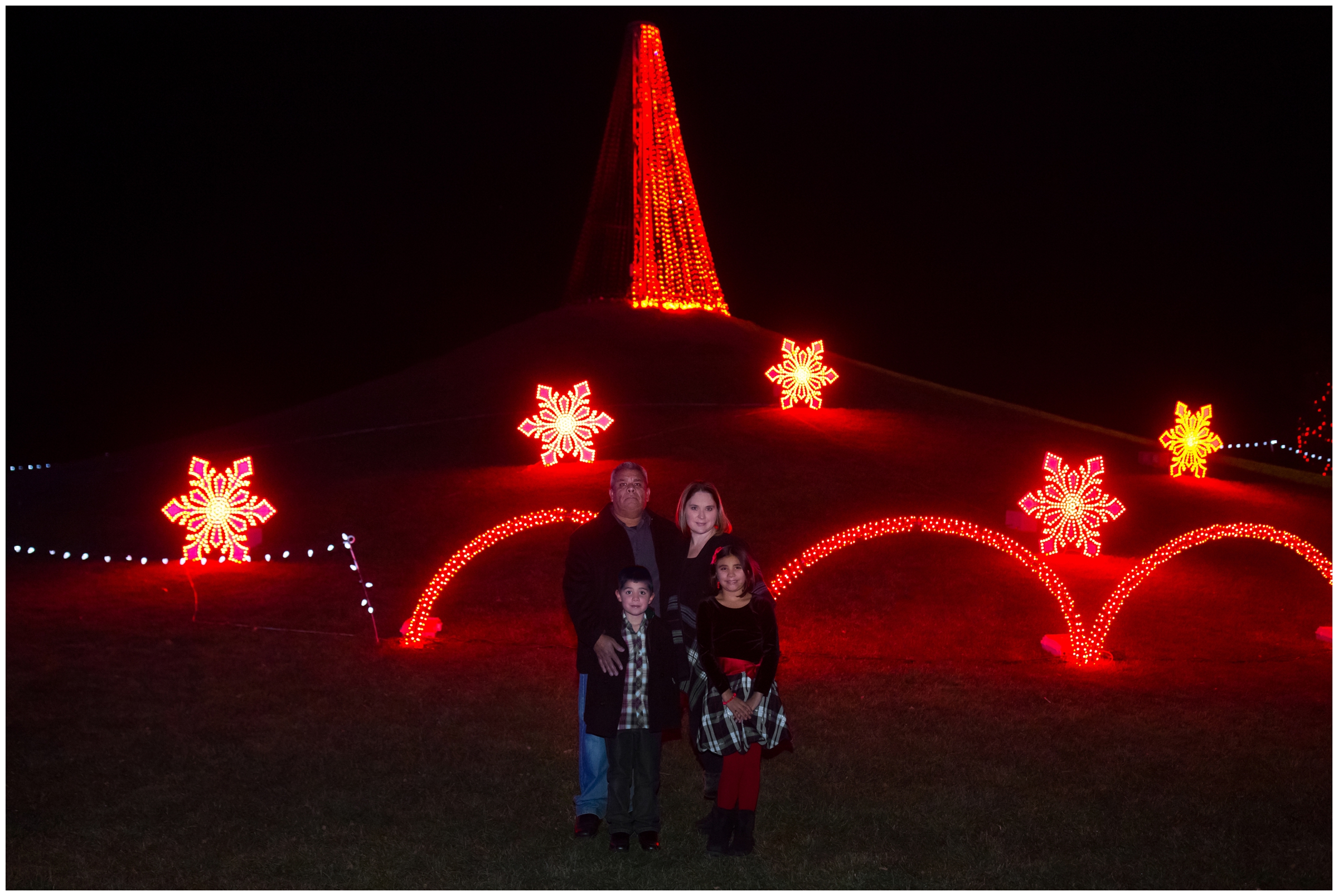 nighttime Loveland Colorado family pictures at Winter Wonderlights at Chapungu Sculpture Garden