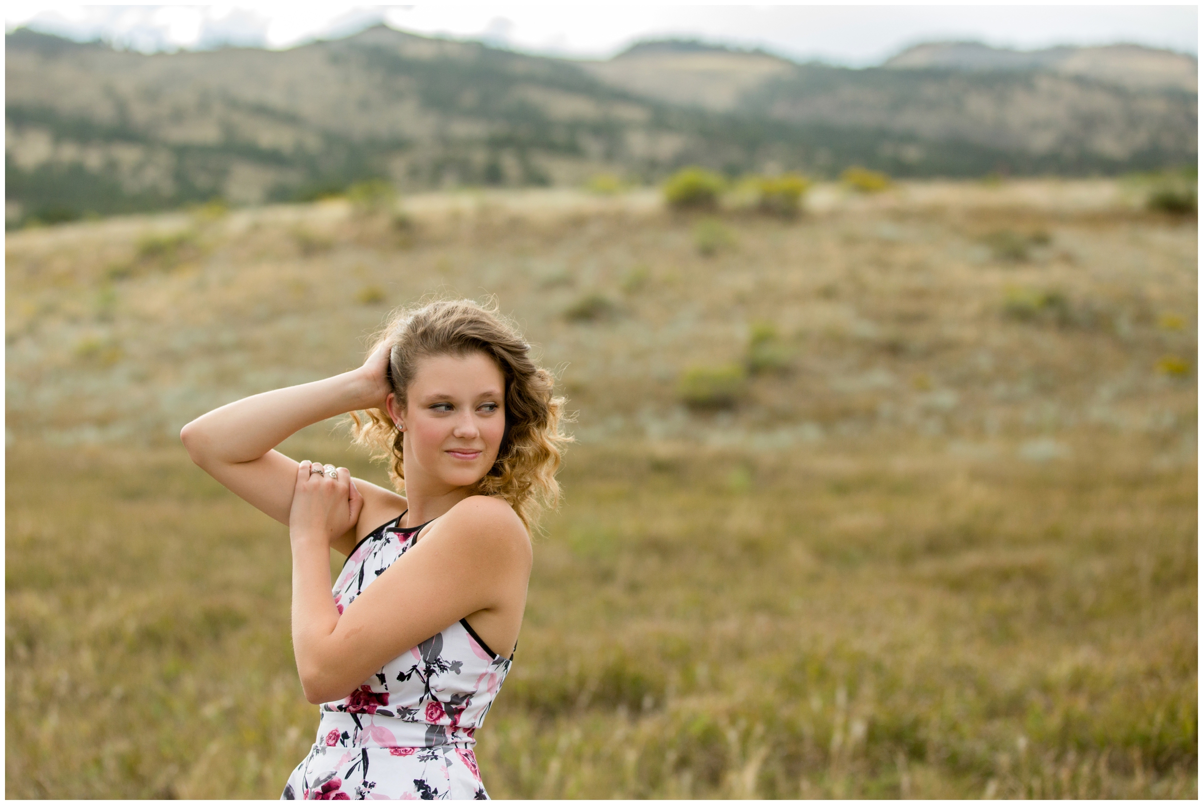 teen girl posing with mountains in background during Ft. Collins senior portraits 