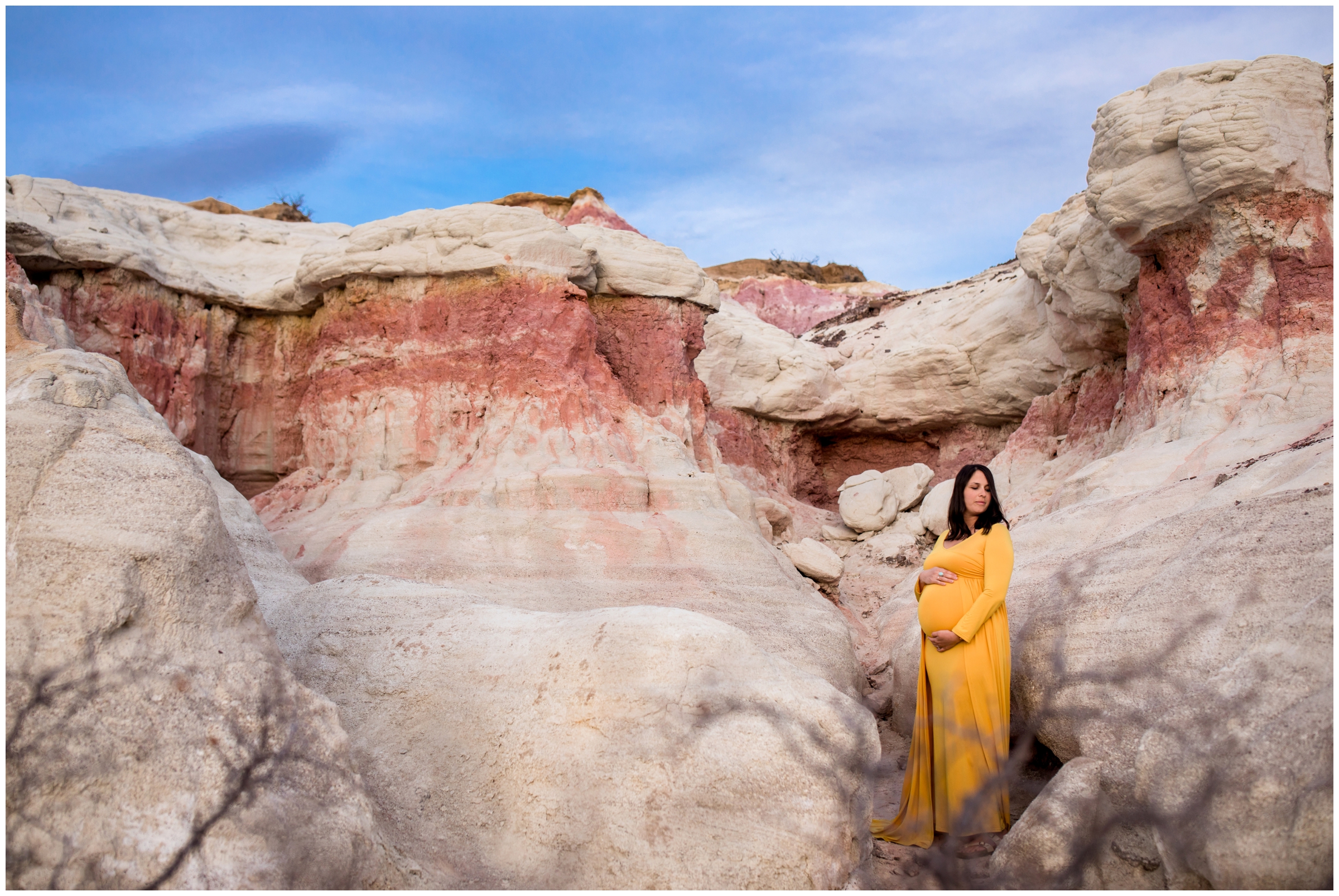 pregnant woman posing in the Paint Mines Interpretive Park 