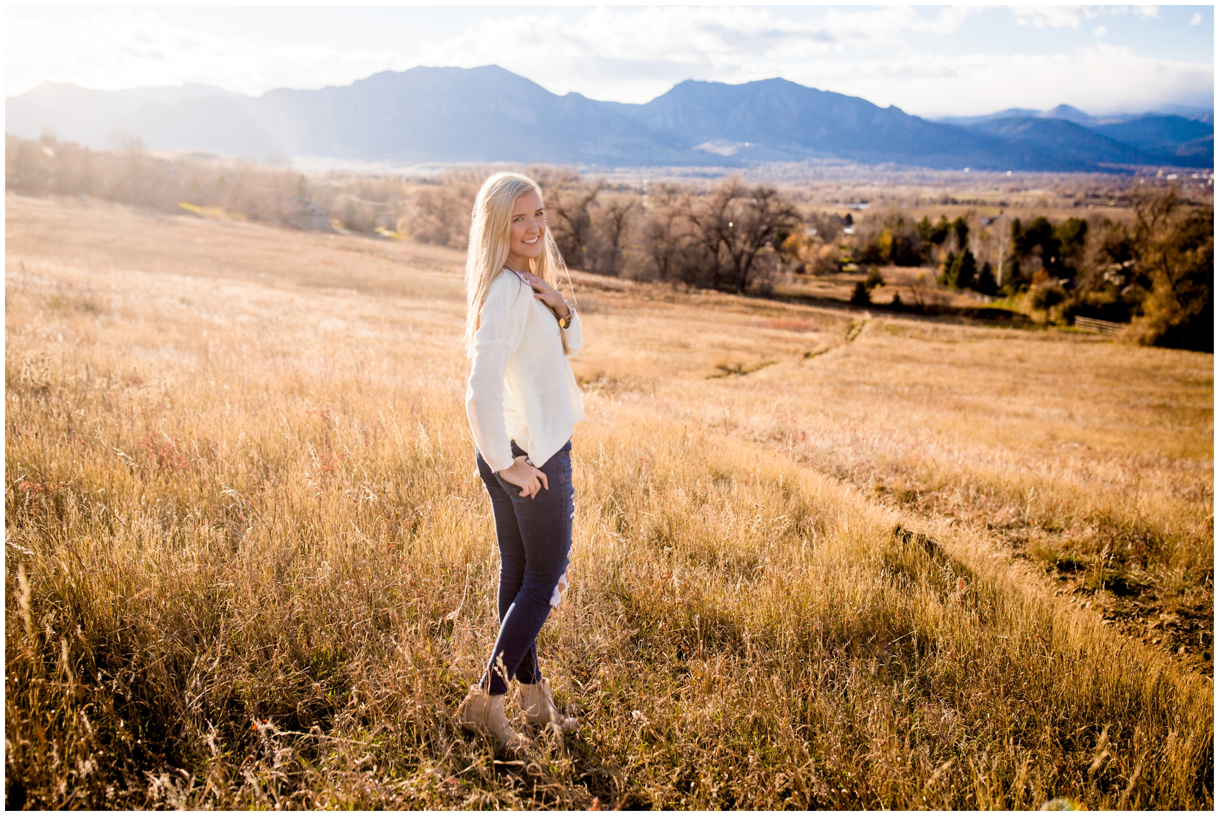 teen posing in open field during Boulder Colorado mountain senior pictures 