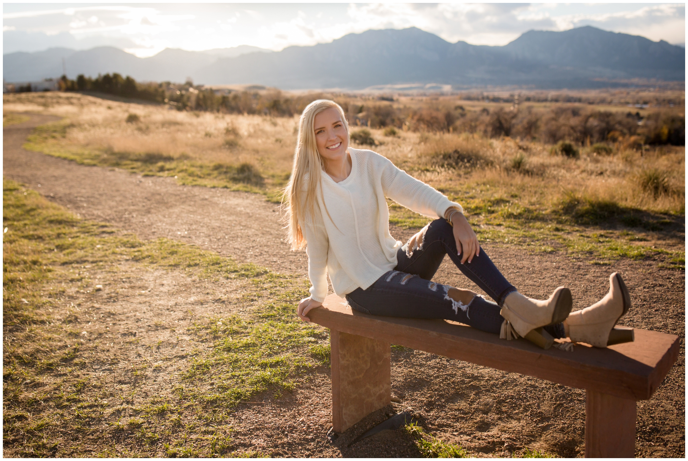 erie high school senior posing on bench during Colorado fall senior pictures