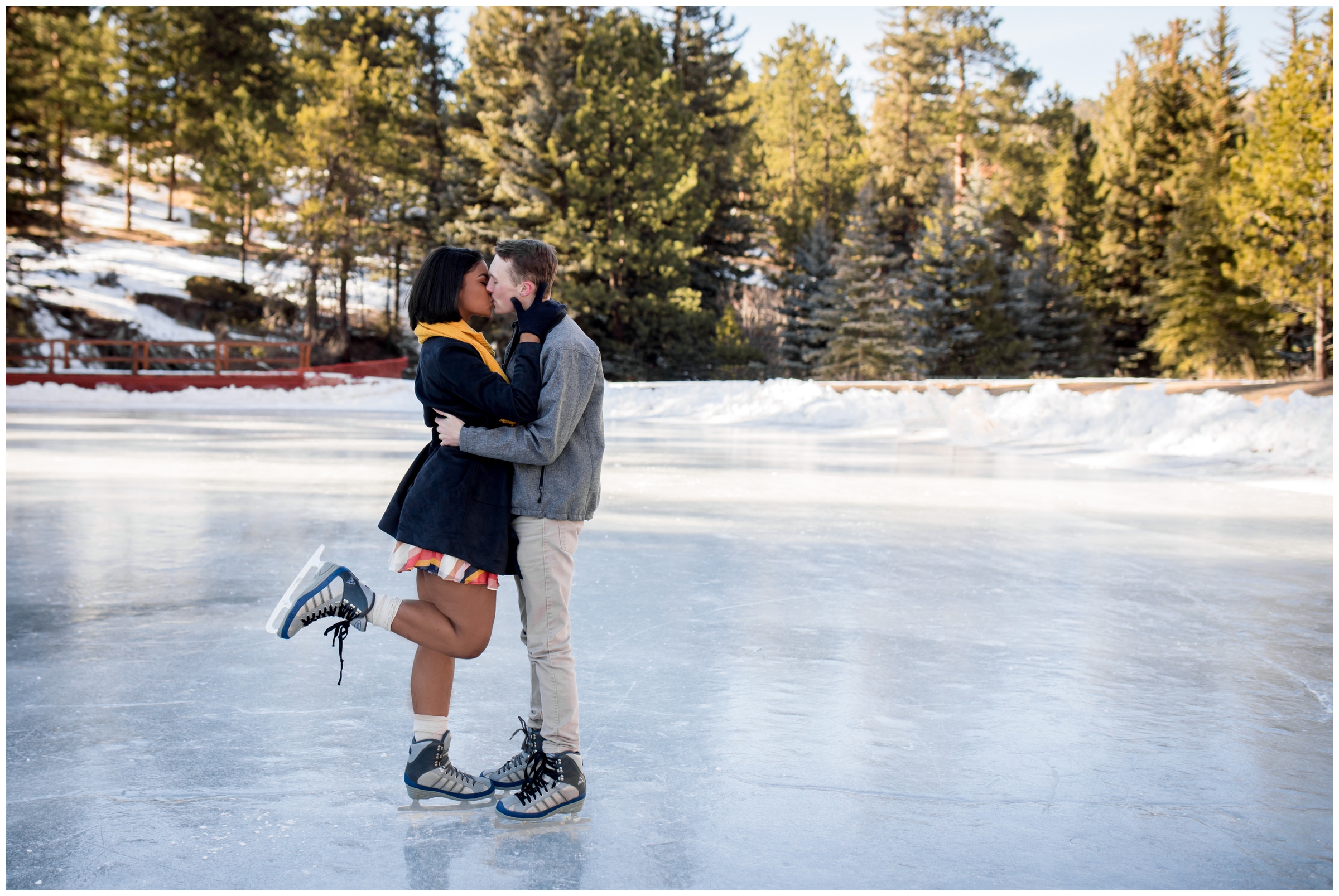 couple ice skating on frozen lake during Colorado winter engagement photos by Estes Park wedding photographer Plum Pretty Photography