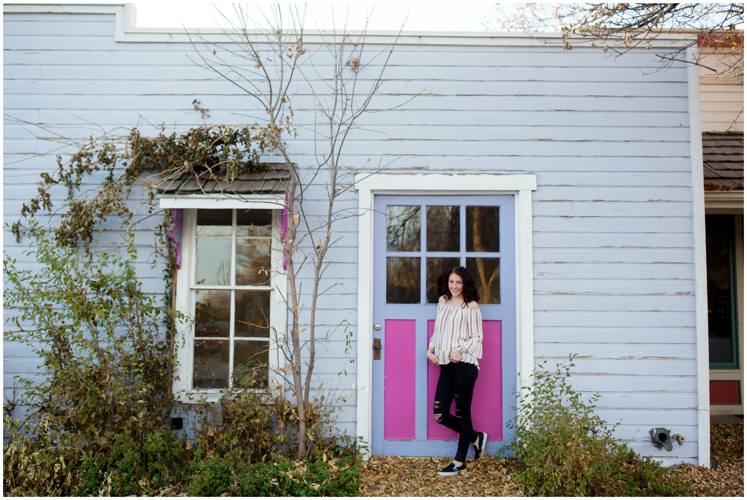 teenage girl posing against a pink and purple door in Niwot Colorado 