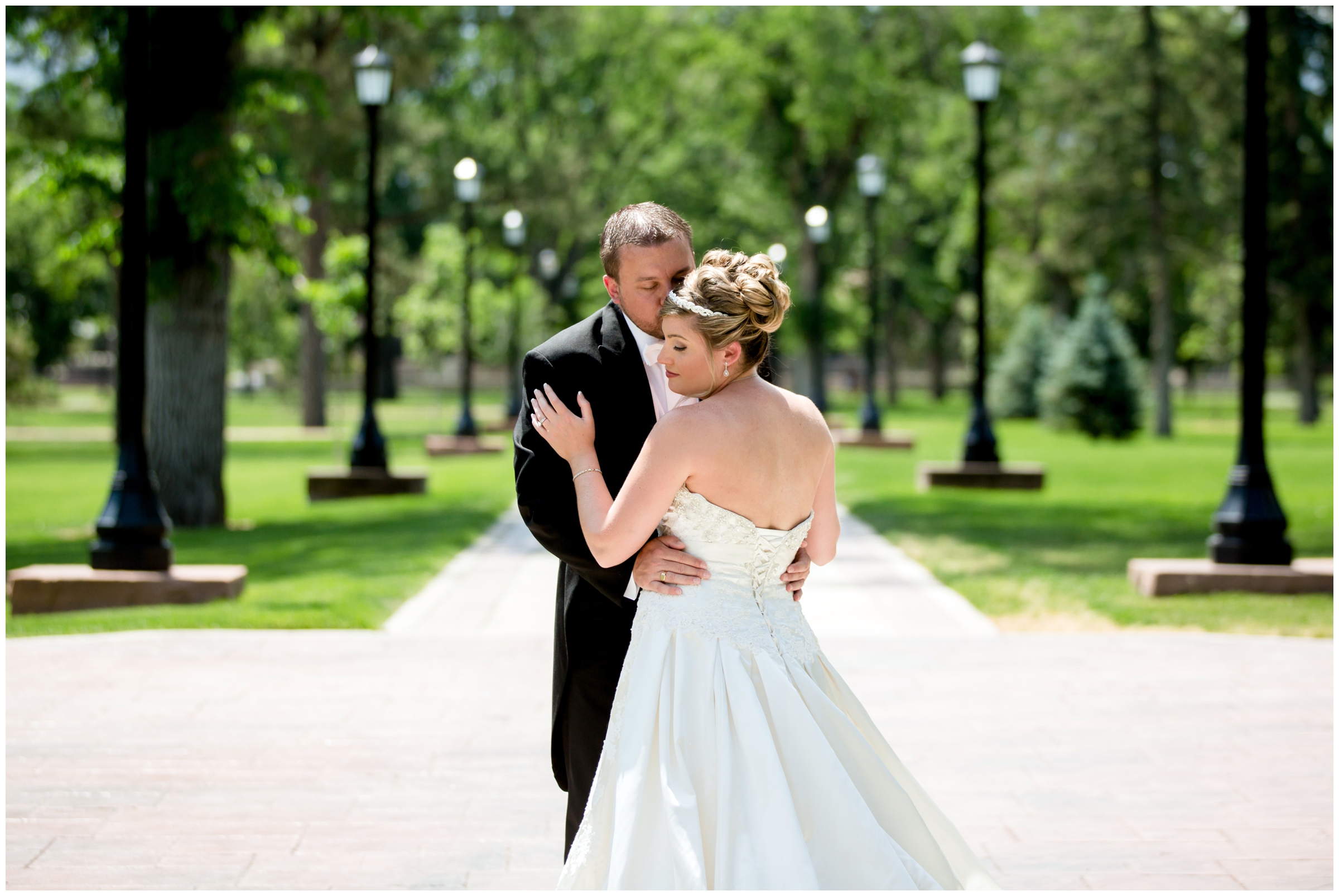 bride and groom posing outside Shove Chapel during Colorado Springs wedding pictures 