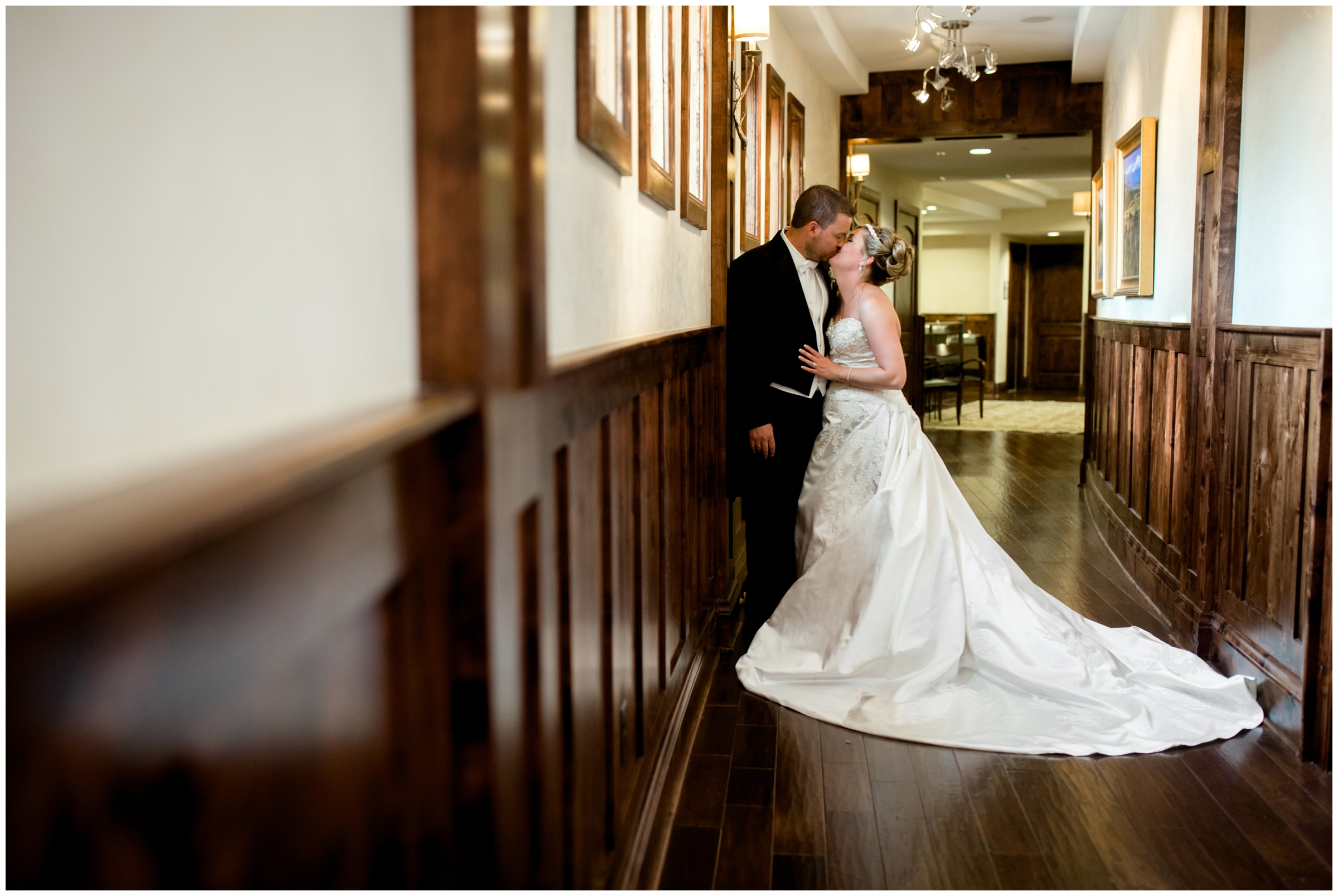 bride and groom kissing in hallway at the Pinery at the Hill Colorado springs 