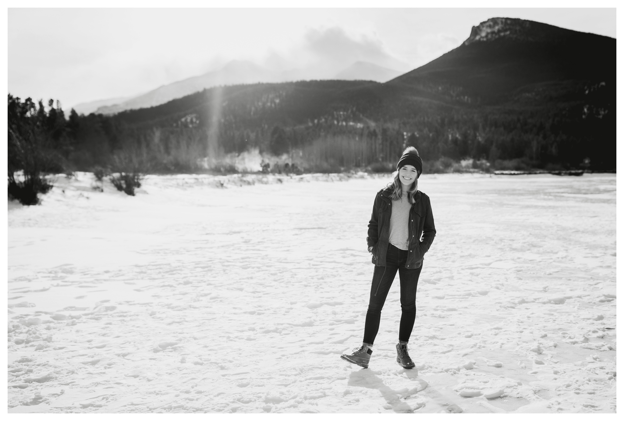 teen girl posing in snow during snowy Colorado winter senior pictures 