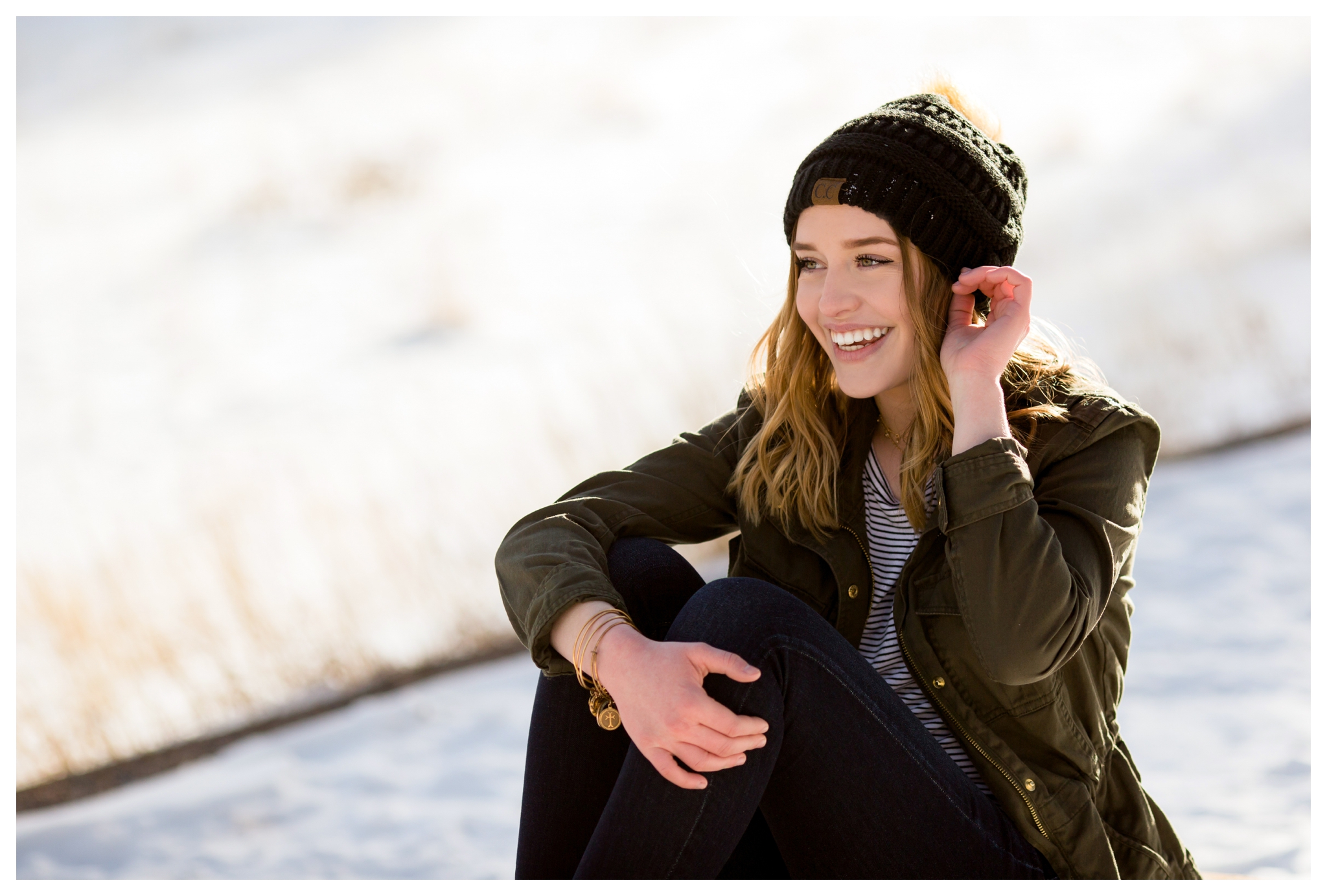 teen posing in beanie during Colorado winter senior photos in Rocky Mountain National Park by Estes Park photographer Plum Pretty Photography