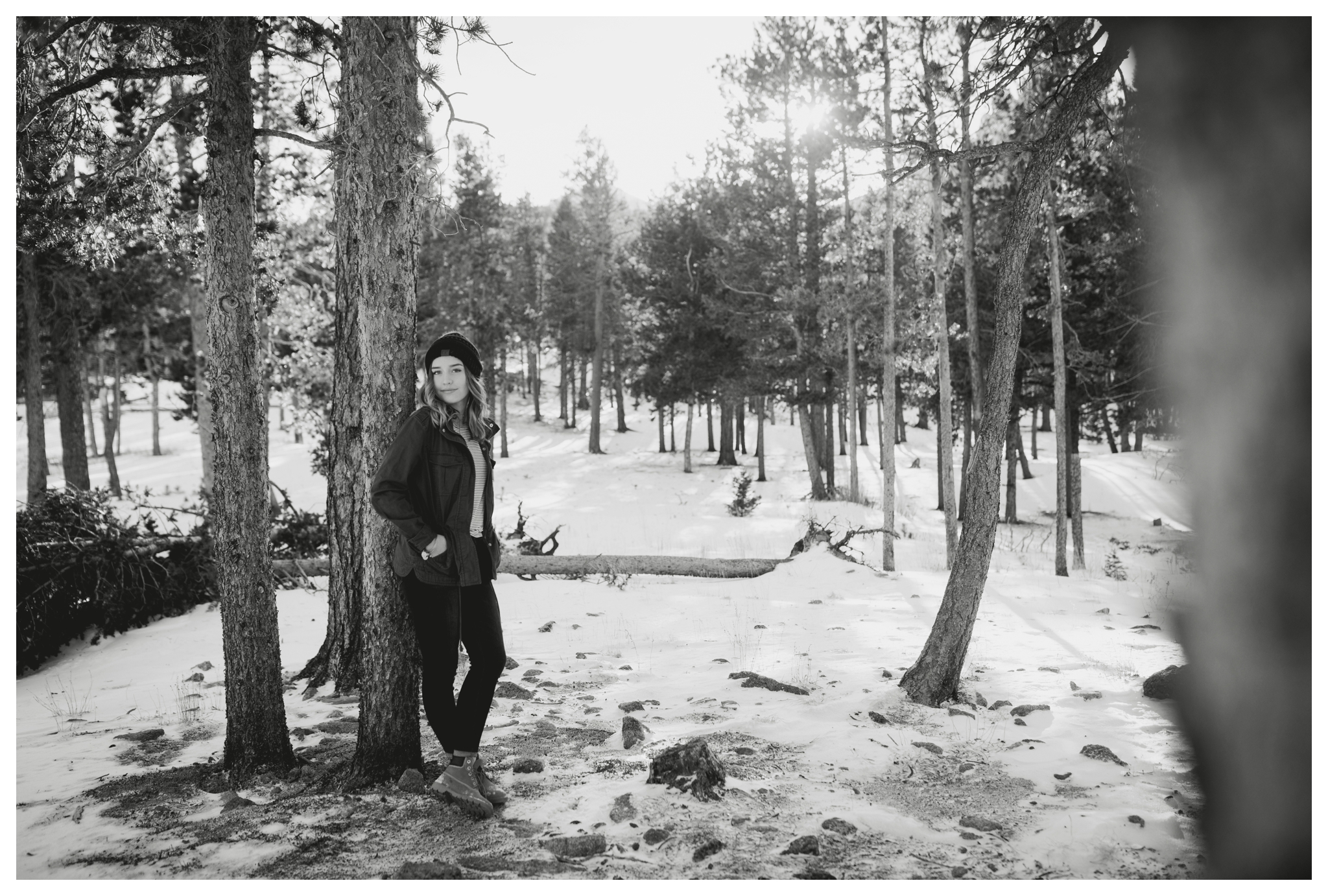 teen leaning against a tree during Estes Park Colorado senior pictures