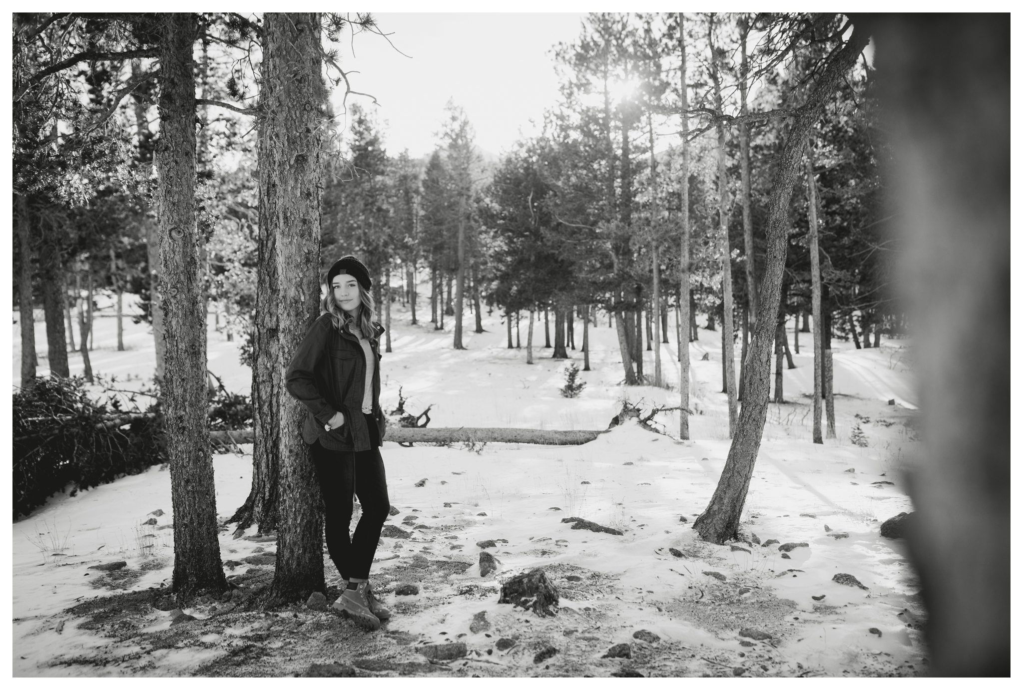 teen leaning against a tree during Estes Park Colorado senior pictures 