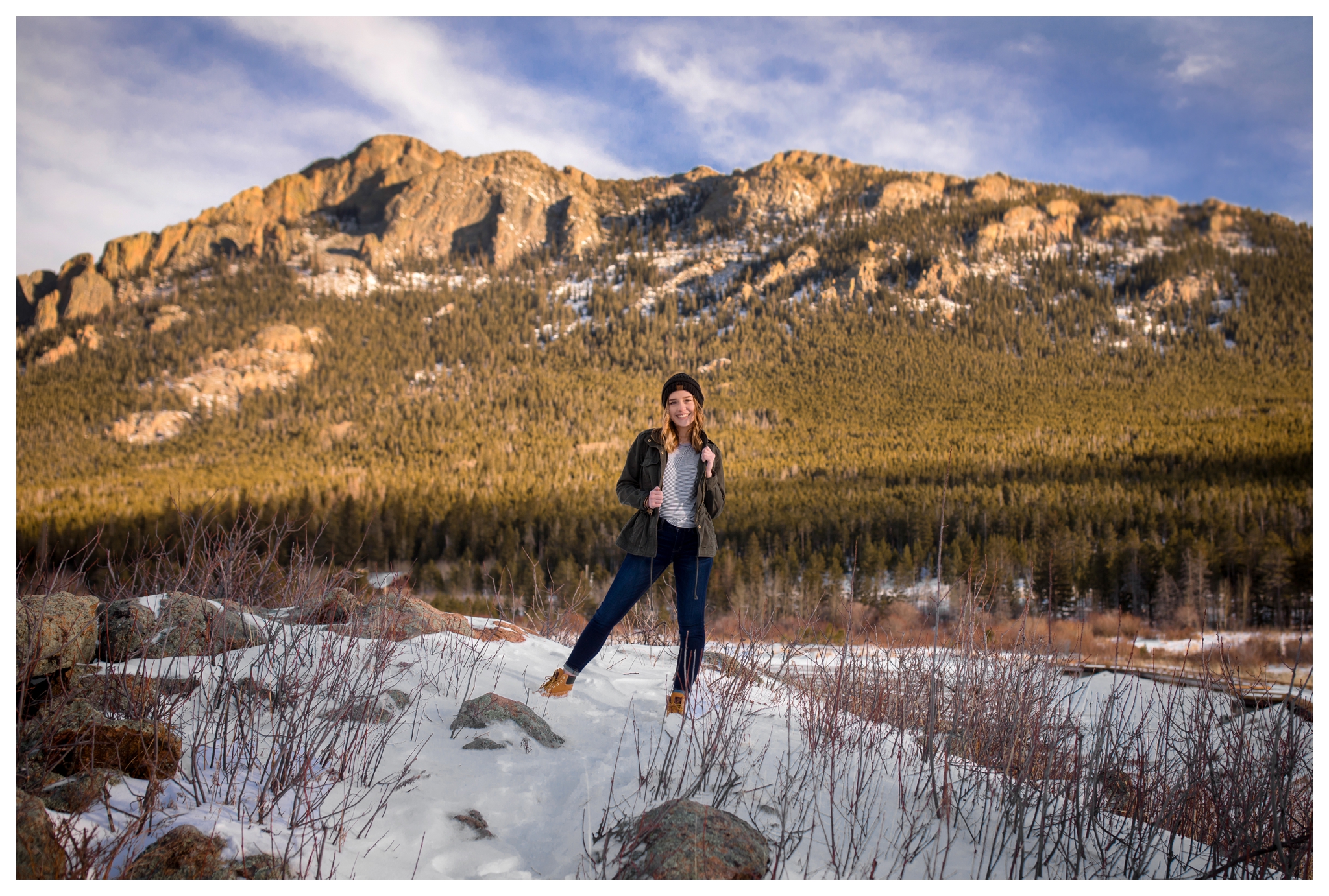 teen girl posing with mountains in background at Lily Lake RMNP 