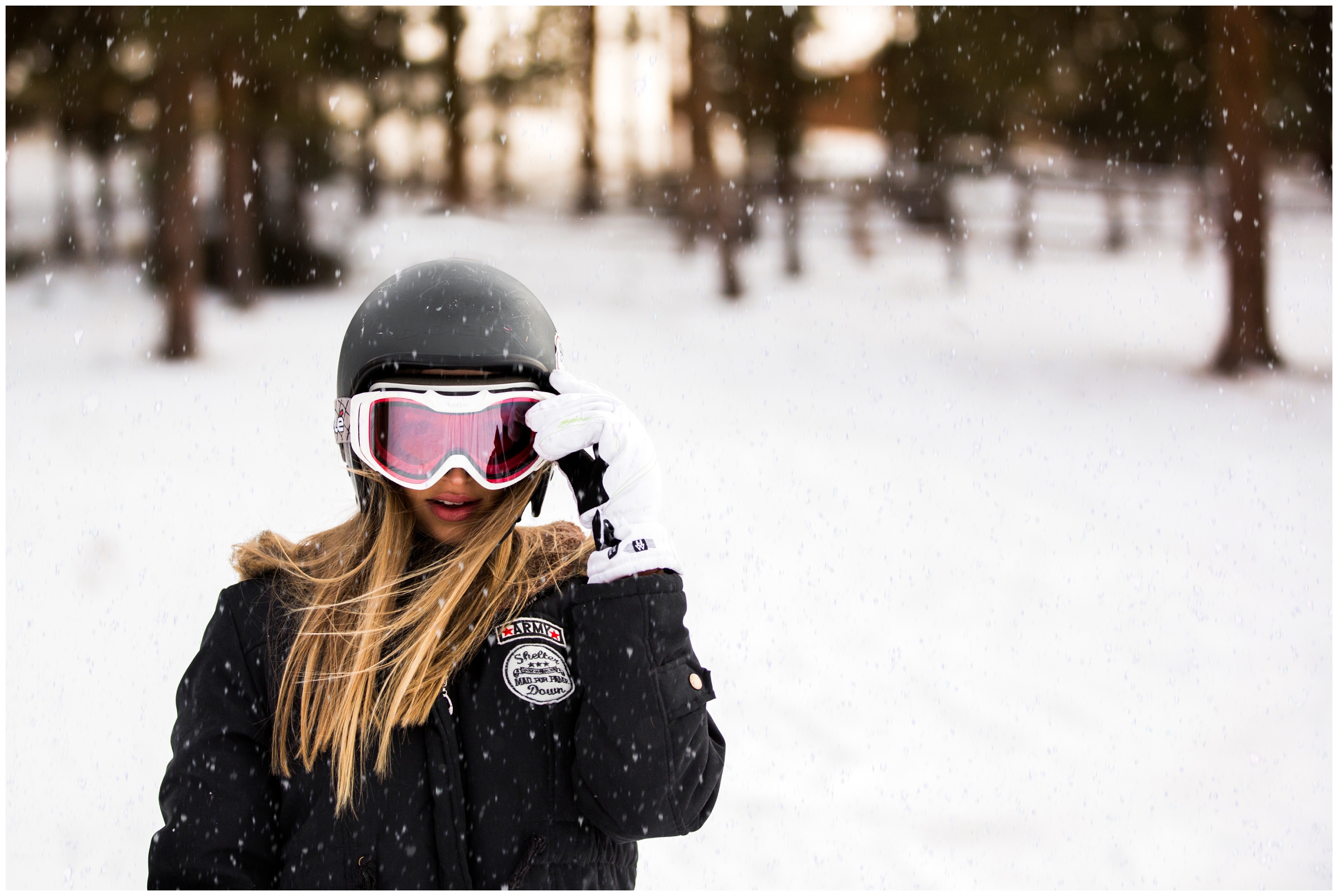 teen girl modeling ski goggles in Estes Park CO