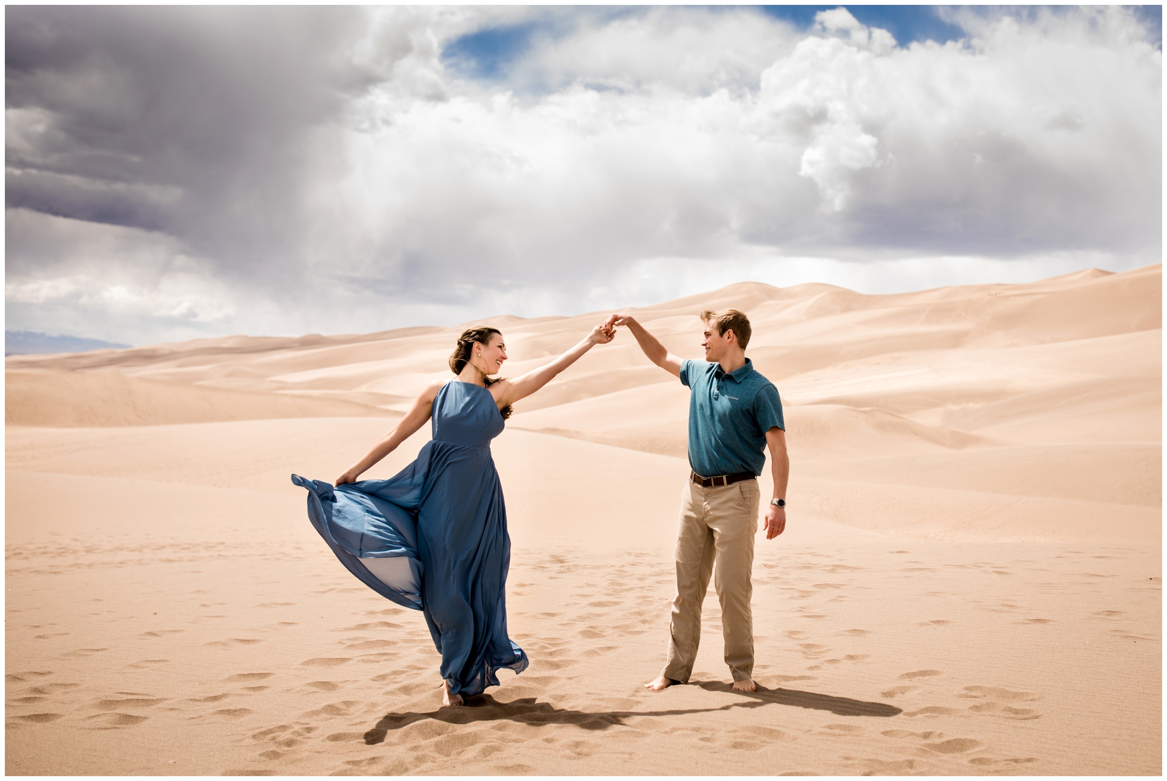 man spinning woman at the Great Sand Dunes National Park during Colorado engagement photography session 