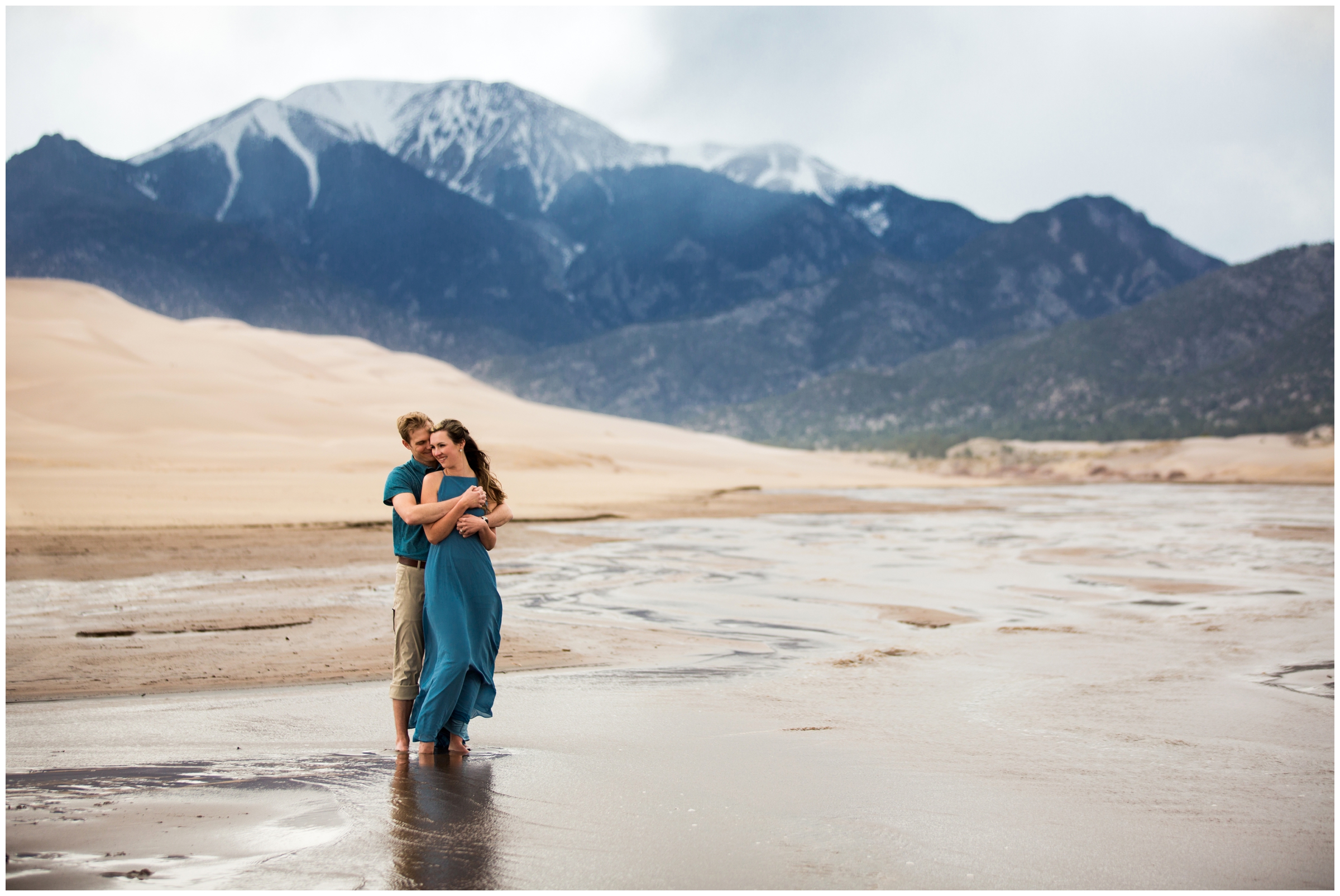 Couple standing in the water during couple's portraits at the Great Sand Dunes National Park