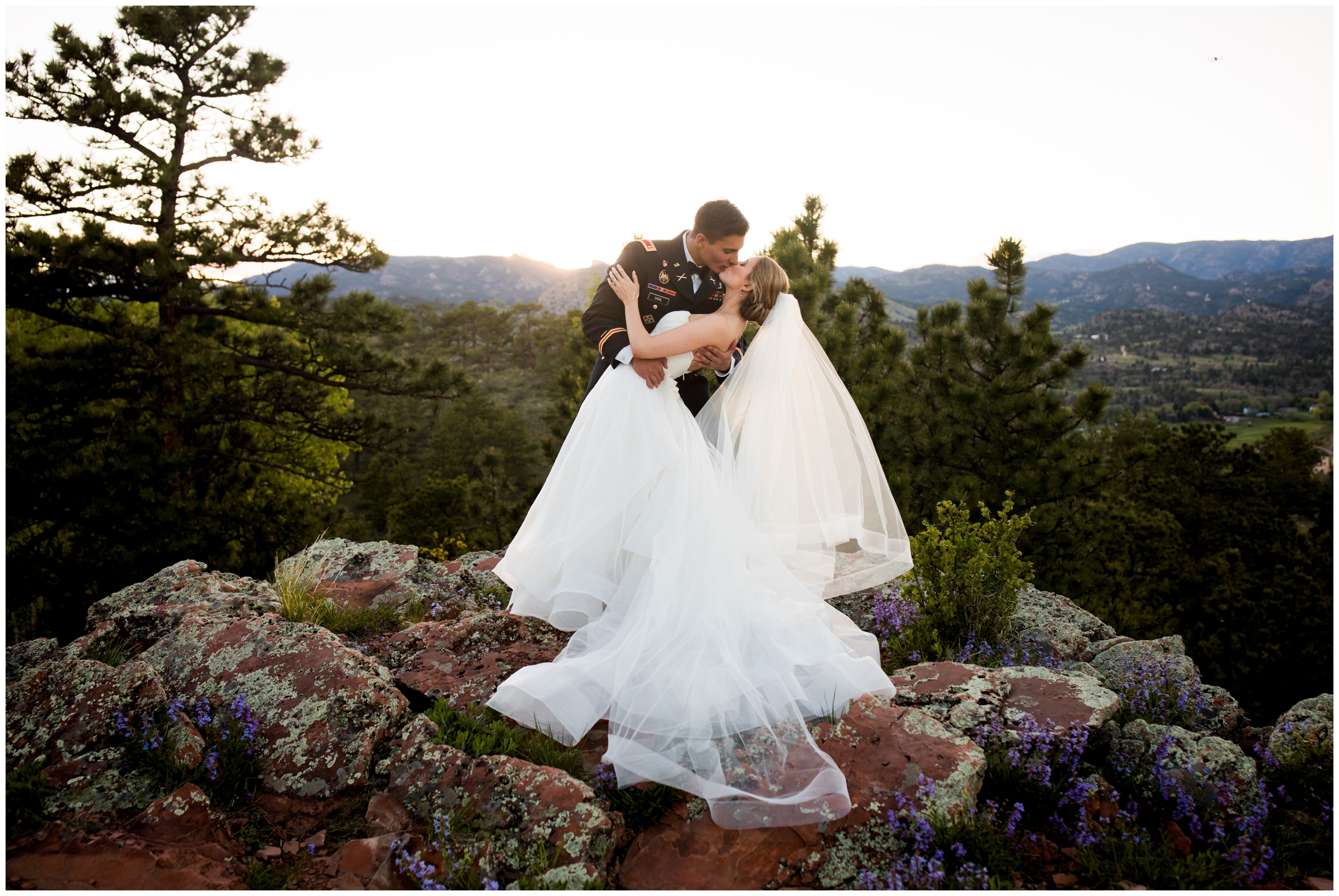 groom dipping bride on mountain at Lionscrest Manor Colorado wedding pictures 