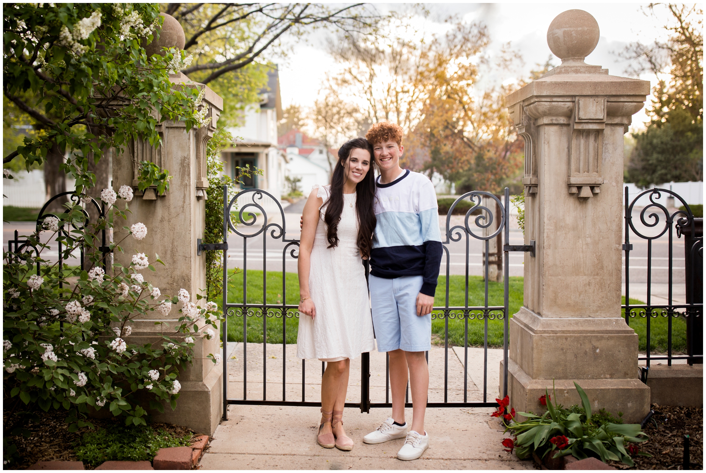 mother and son posing in front of wrought iron gate during Longmont Colorado family photography session 