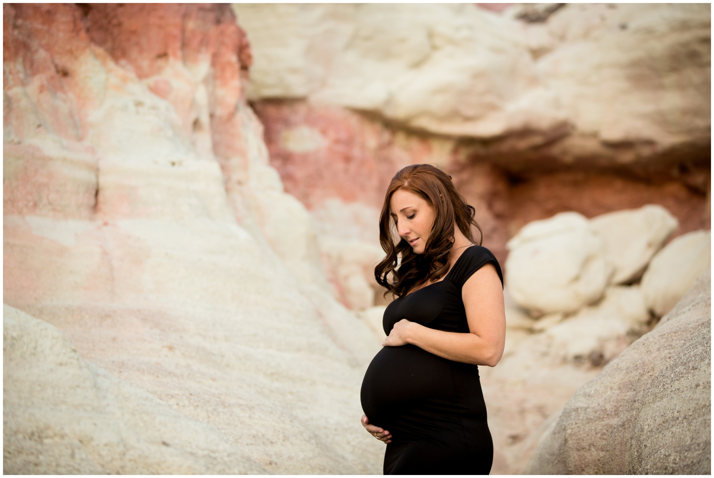 form fitting black maternity gown photographed during Colorado Springs maternity pictures 